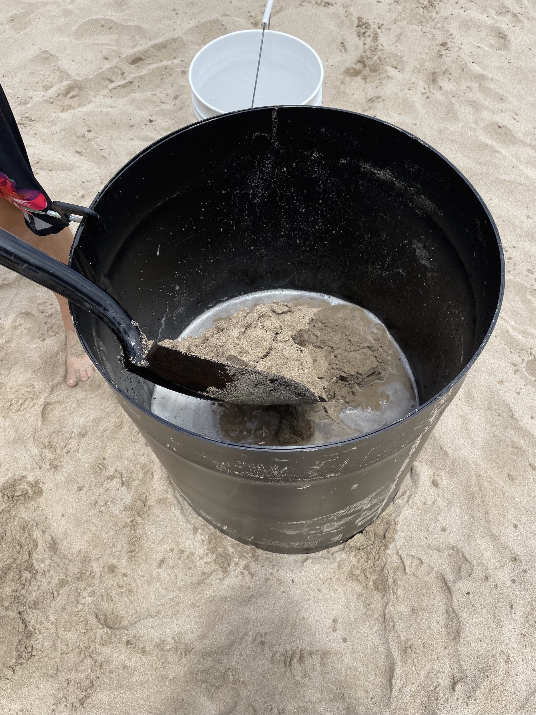 Layer by layer campact the sand in the form