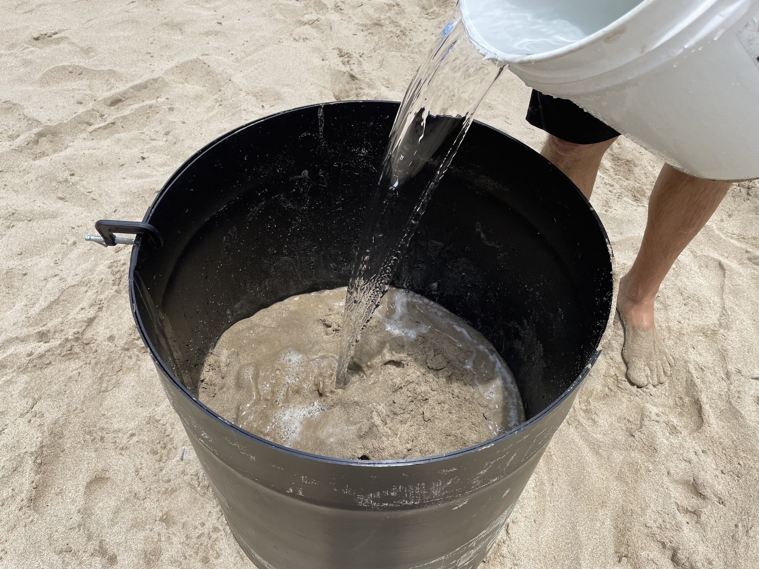 put water and sand layer by layer in your form to make a sand castle