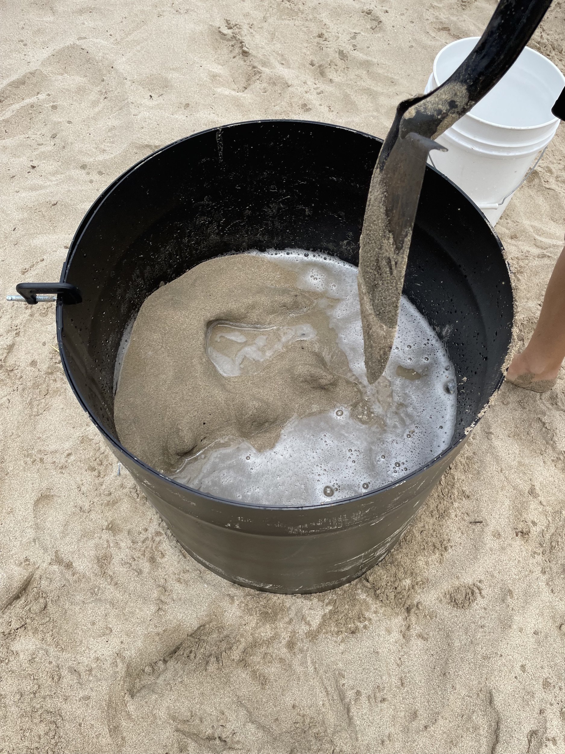 hard pack sand using a plastic form at the beach