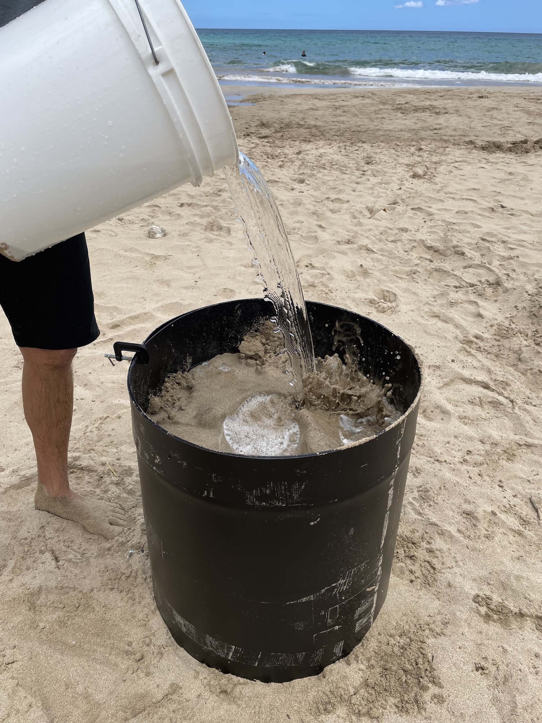 put sand and water in the form to compact the sand