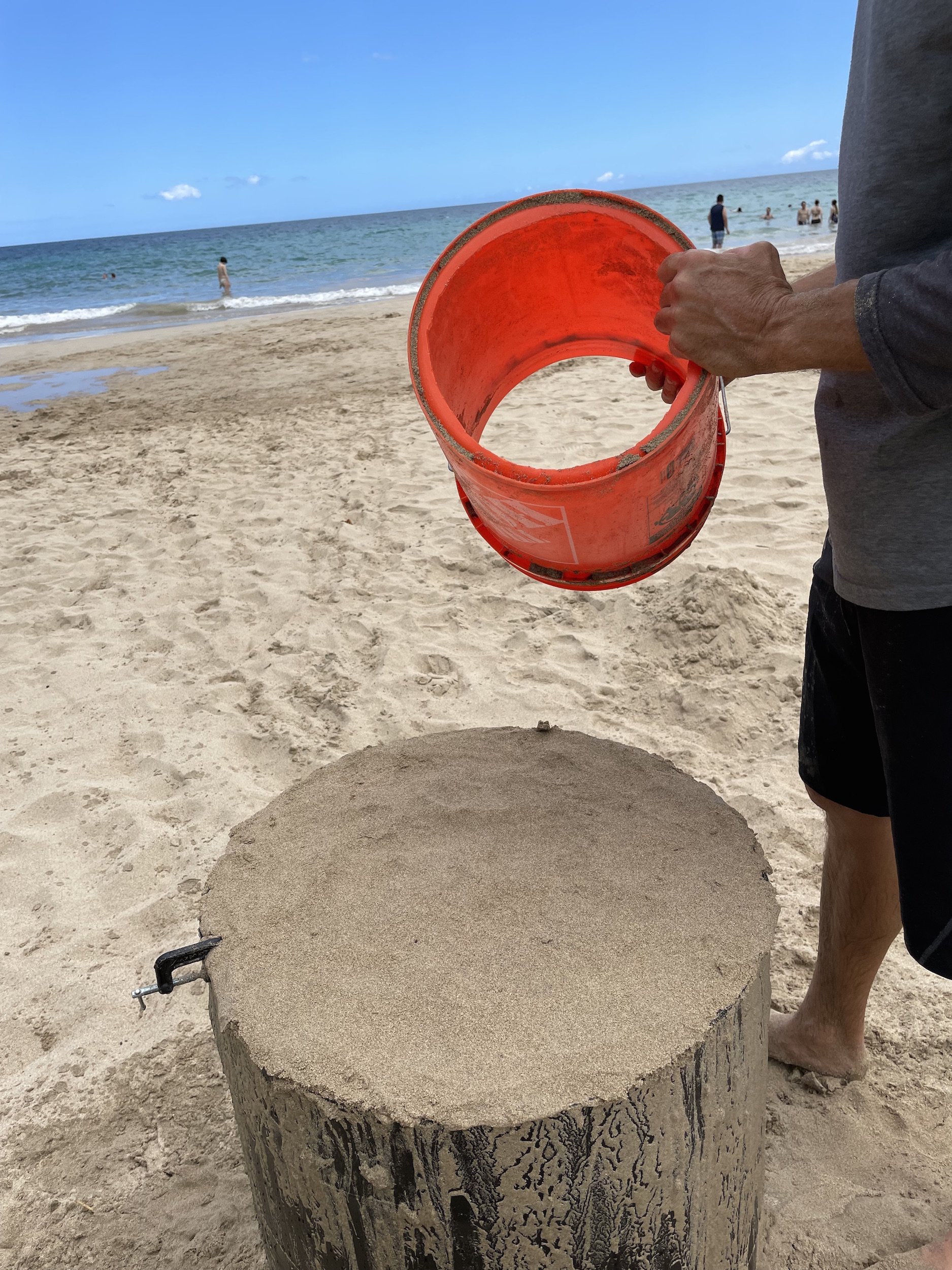 use a 5 gallon bucket to create a higher sand castle