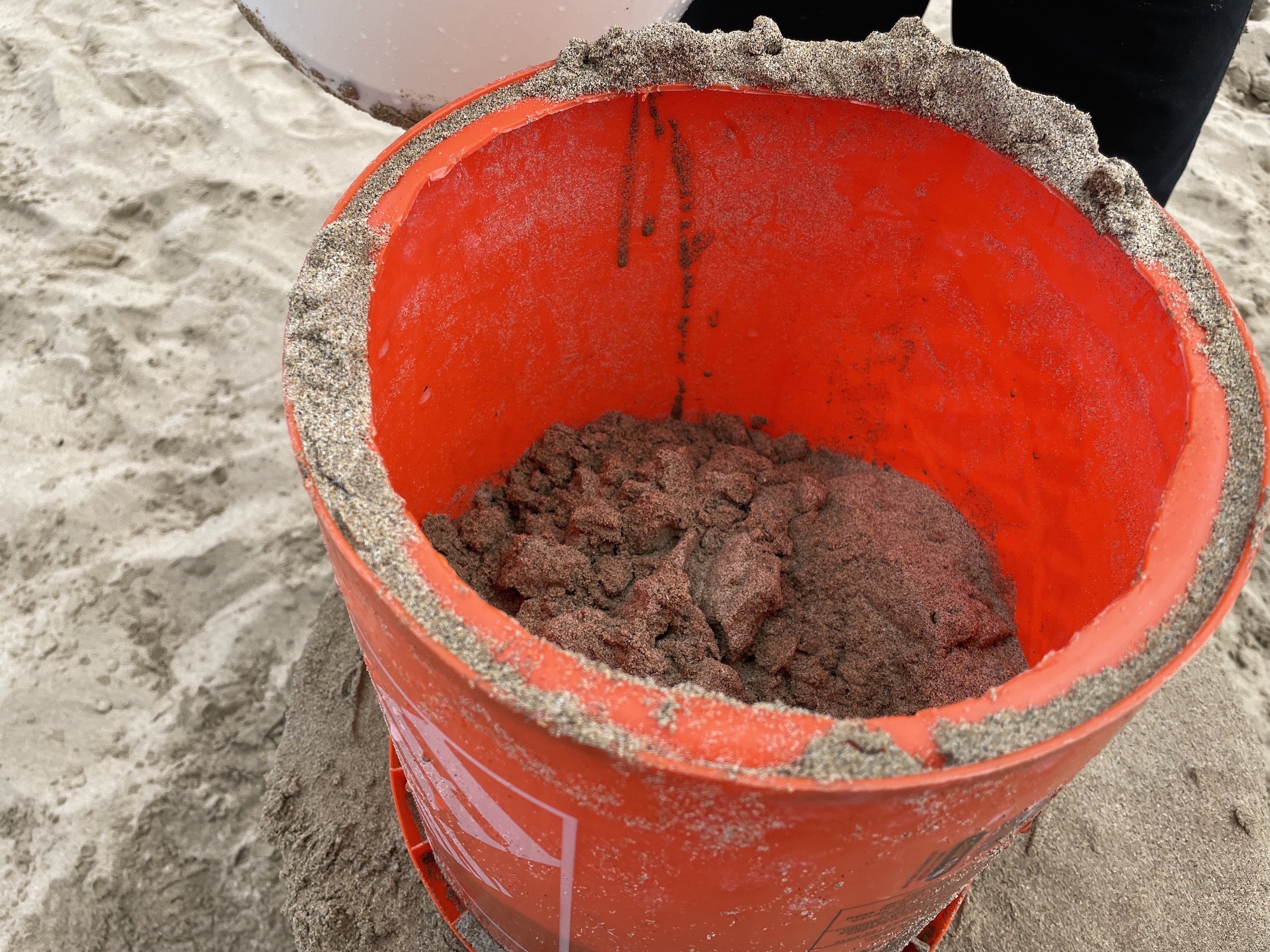 use a 5 gallon bucket to create a sand sculpture