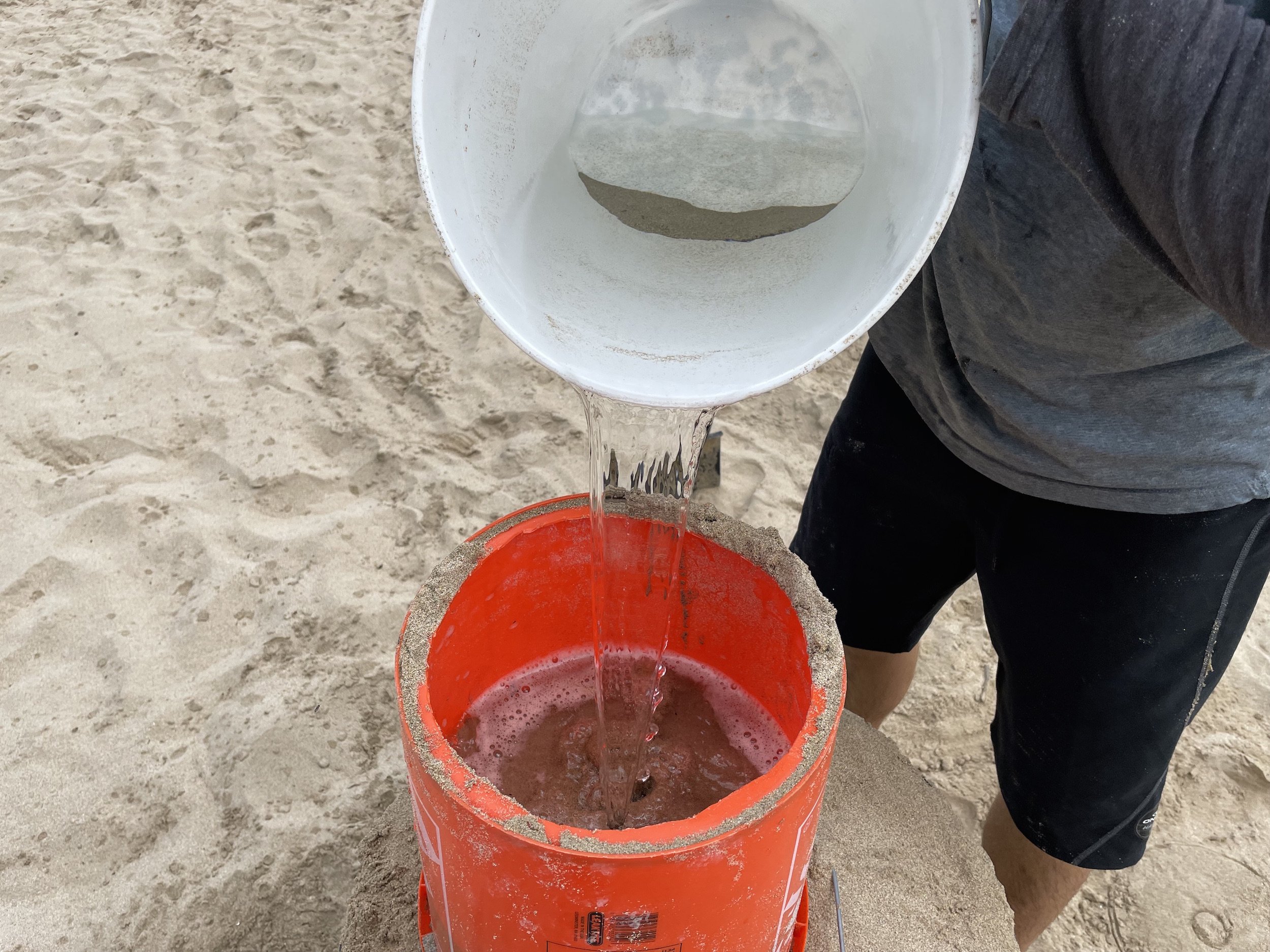 make a high sand sculpture using a 5 gallon bucket
