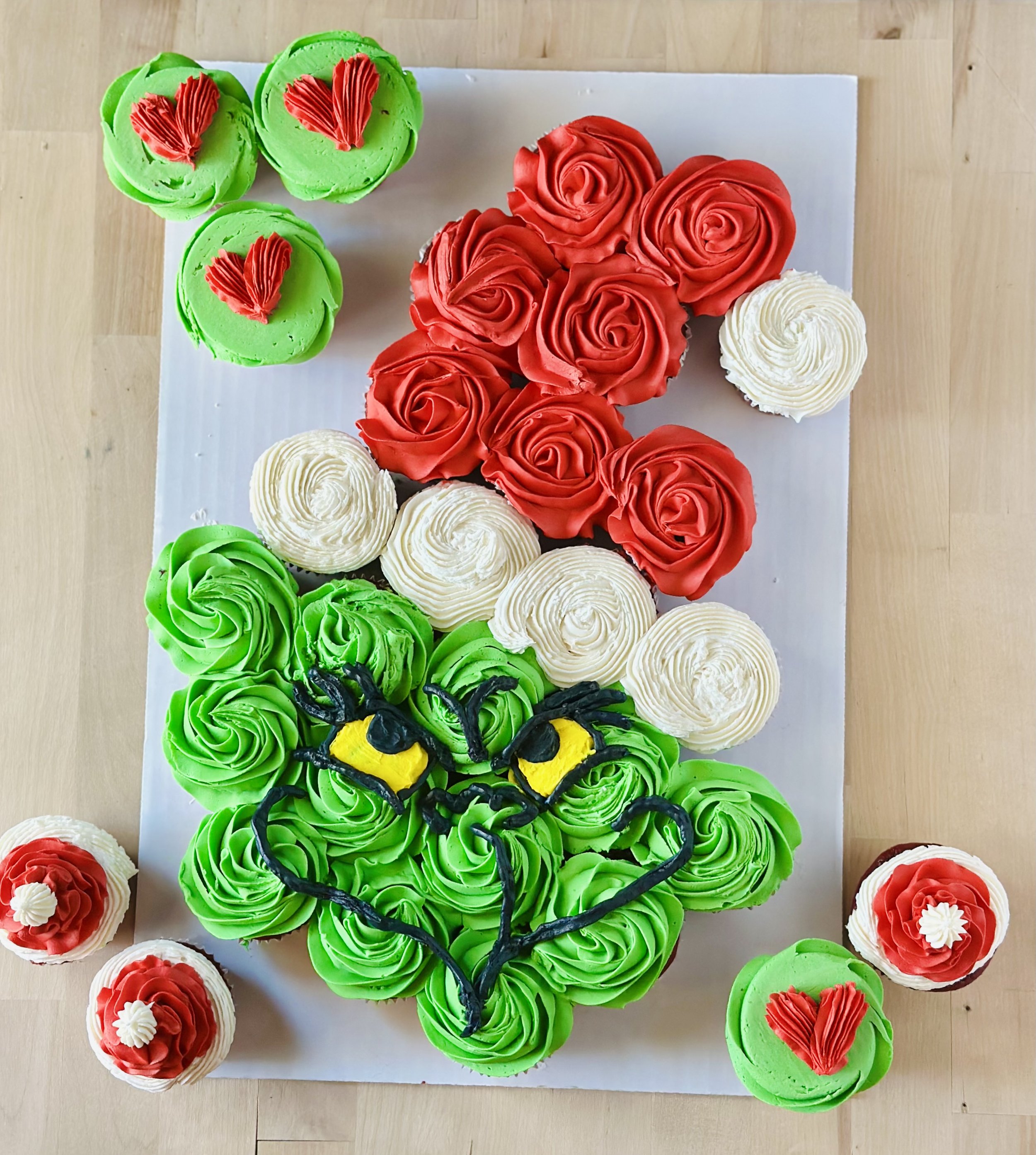 Grinch-themed cupcake arrangement for Christmas