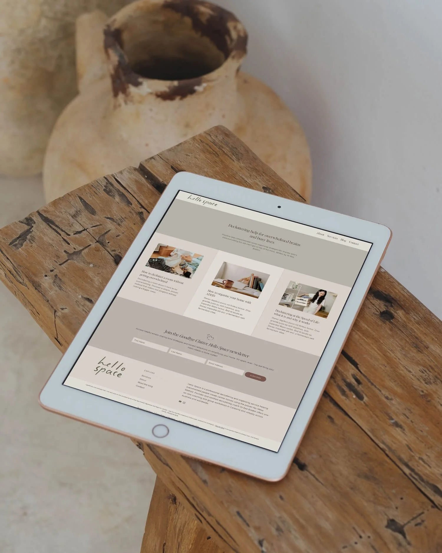 Hello Space decluttering coach website design displayed on an iPad, showing the blog page and footer.