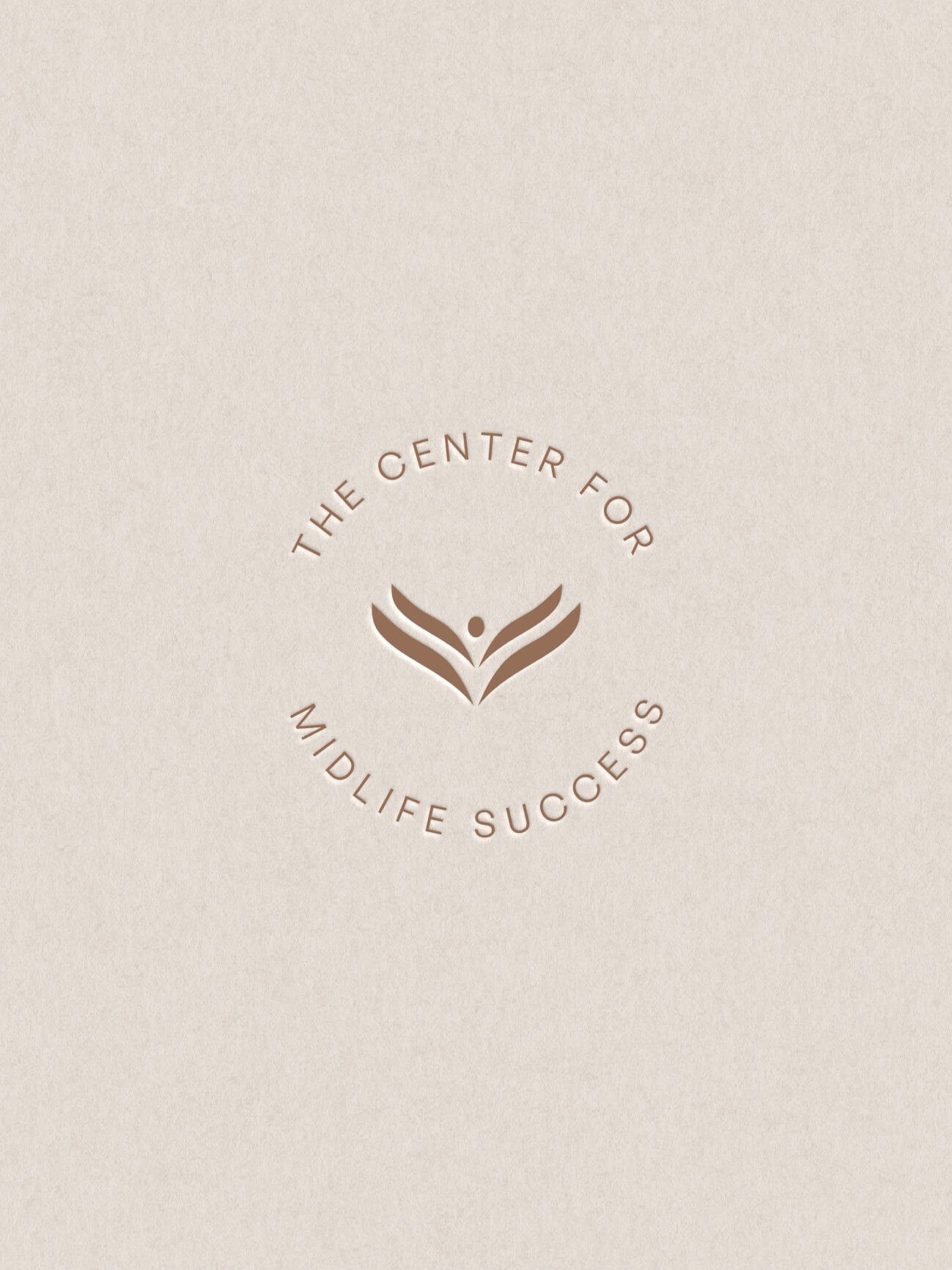 Center for Midlife Success circular brand badge in boardwalk brown on a warm pebble background, created using the Eviya brand kit by Alana Jade Studio.