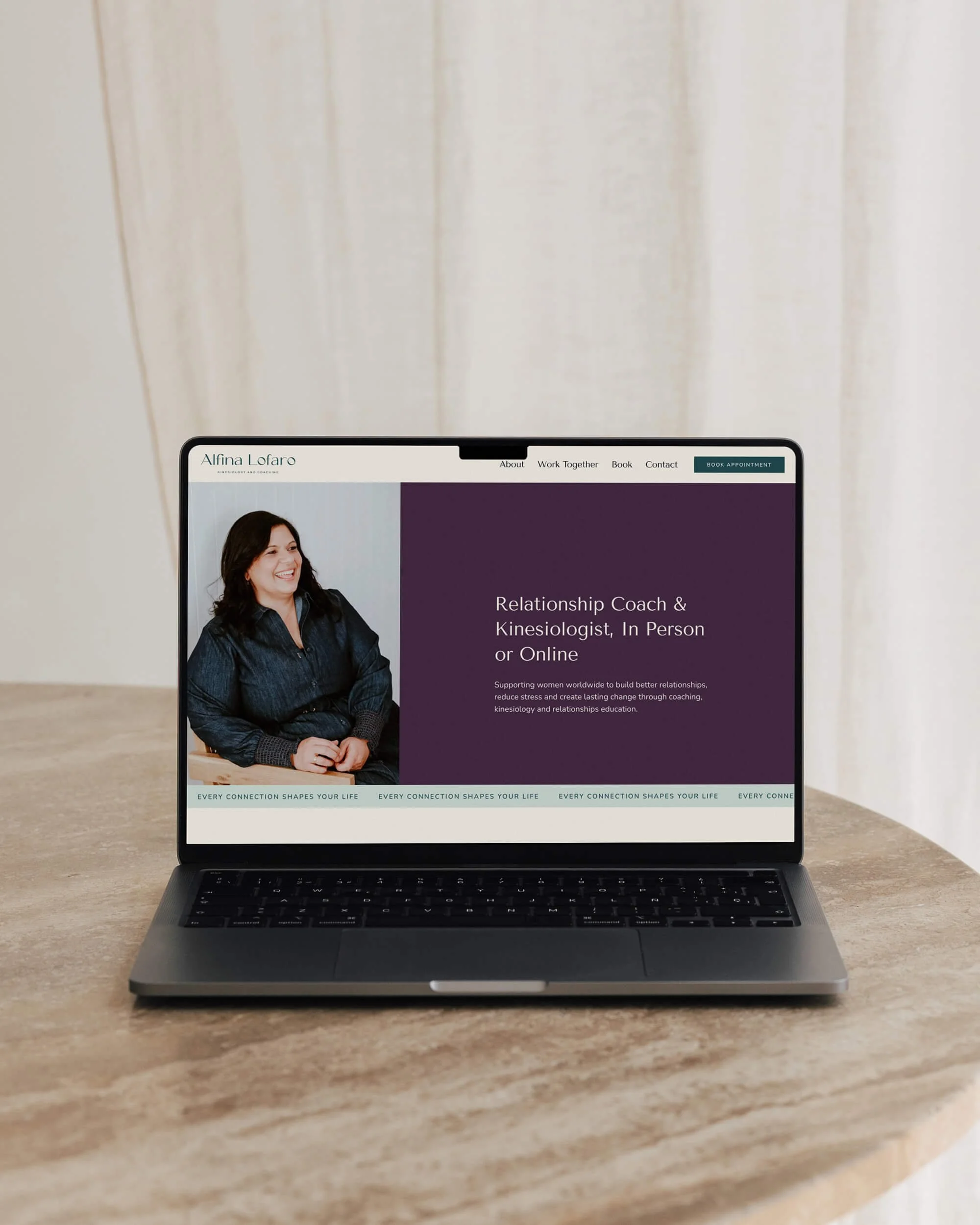 MacBook mockup of a deep purple website homepage hero for a relationship coach and kinesiologist in Brisbane