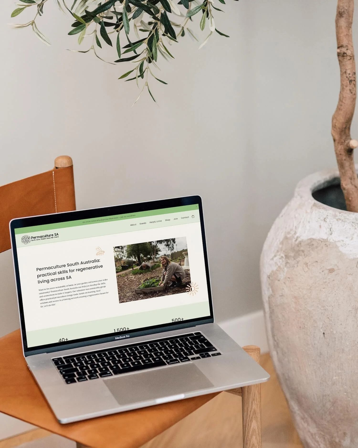 A laptop displaying the hero section on the home page of a Squarespace website created for a nonprofit permaculture organisation
