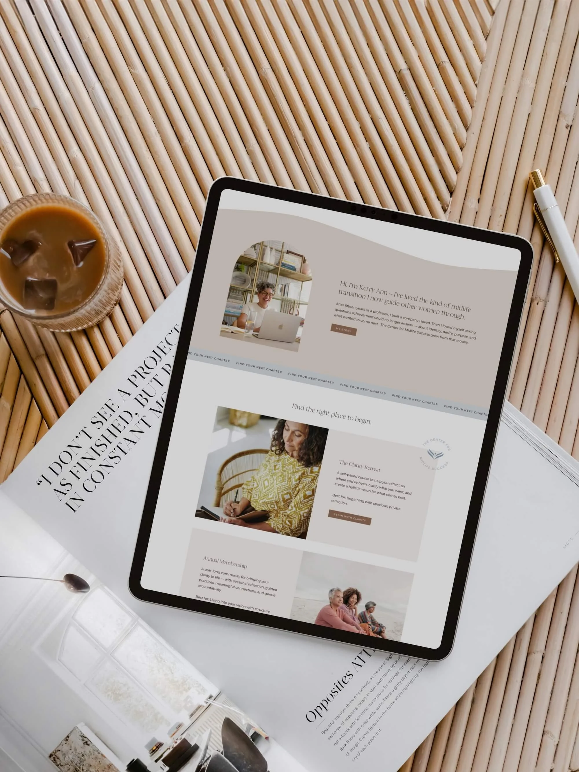 Center for Midlife Success website displayed on an iPad, resting on a rattan surface alongside a magazine and iced coffee, showing the homepage and services section in warm, earthy tones.