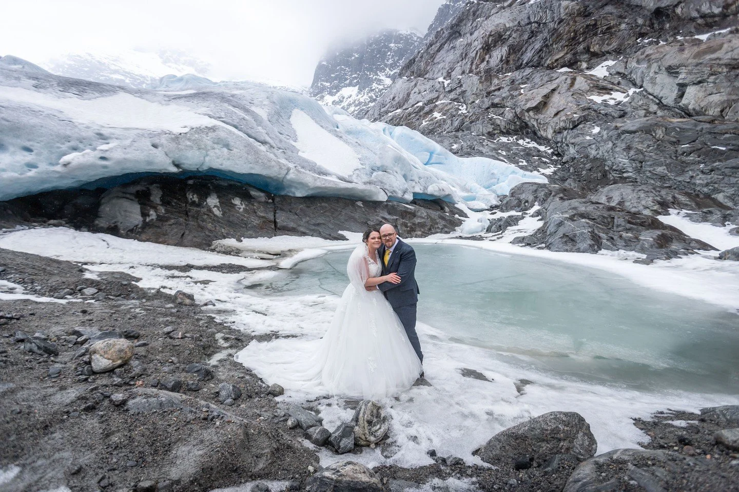 Chris &amp; Taylor got married in front of a glacier. Inside a cave carved from ice.

We do not say this lightly: this is one of the most extraordinary wedding settings we have ever photographed. Ancient blue ice arching overhead. The cold air, still