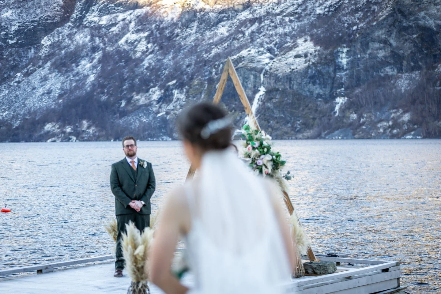 Ian &amp; Lacey | A Norwegian Winter Wedding

There is something about snow underfoot, a fiddler playing by the water, and the mountains rising up around you on your wedding day that changes everything. It turns a ceremony into a memory that lives in