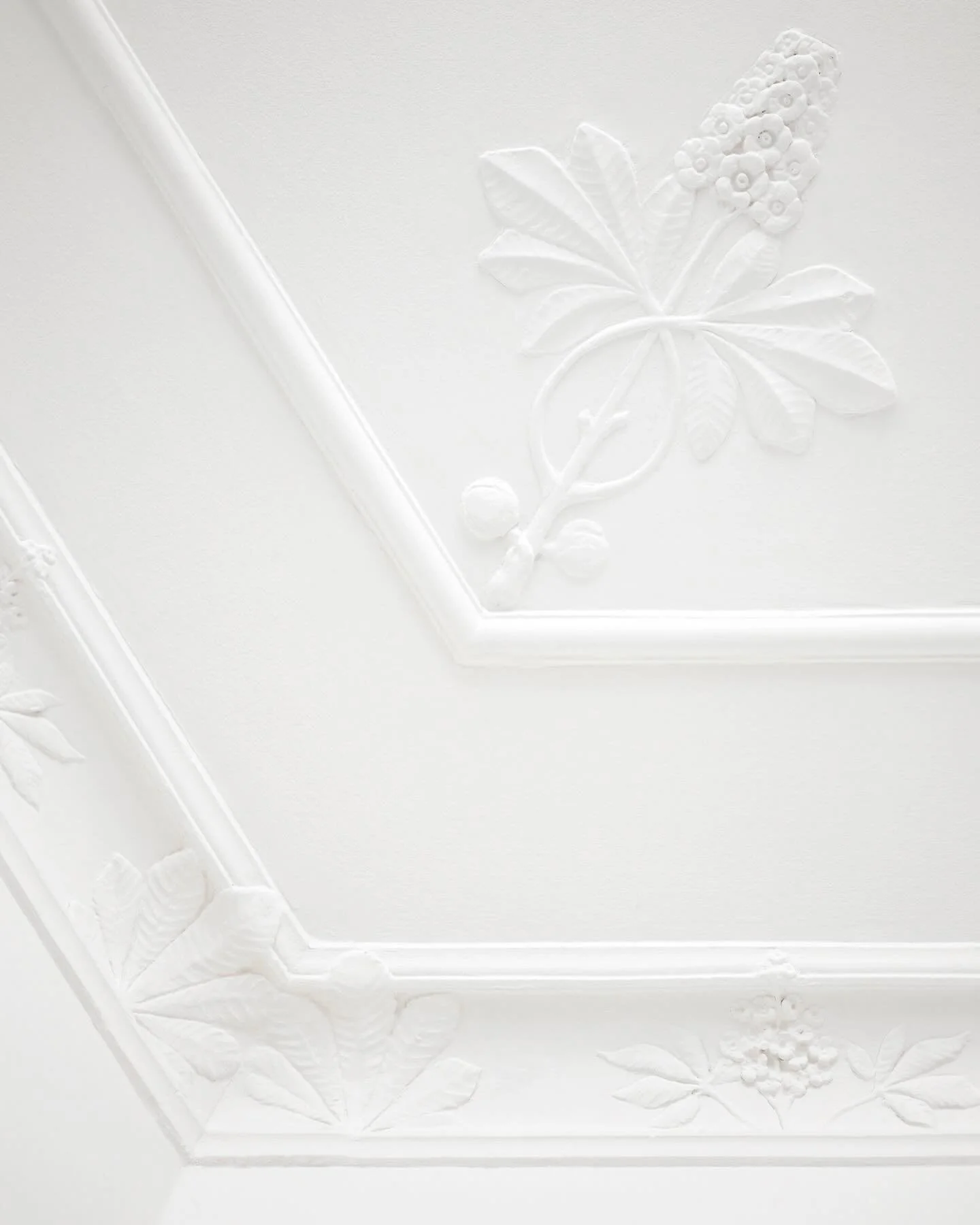 RESTORING ORIGINAL CHARACTER - Our intention was to bring the apartment&rsquo;s character back to its roots with a simple and timeless design. The high panels were meticulously restored, while the many layers of paint on the plasterwork were stripped