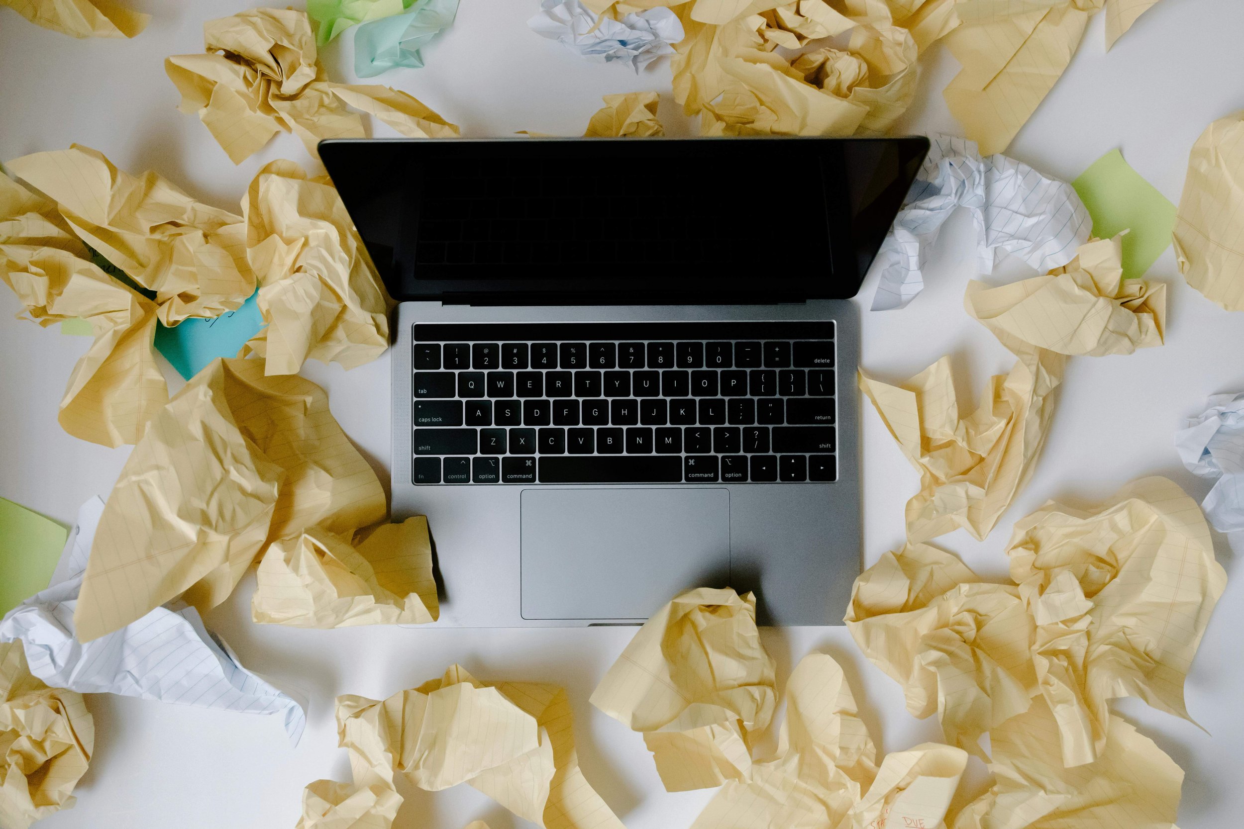 computer with crumpled paper
