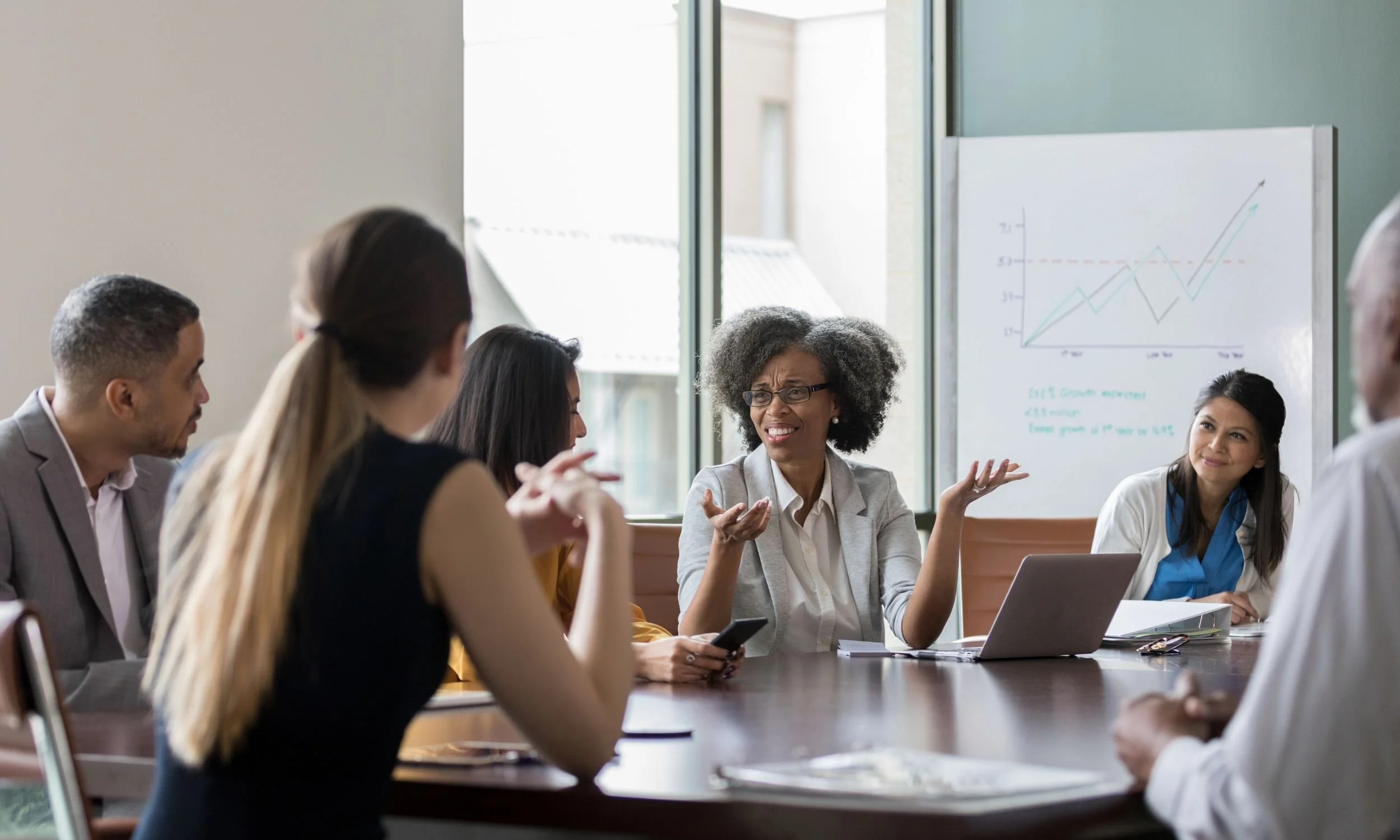 Nonprofit Executive Director in team meeting