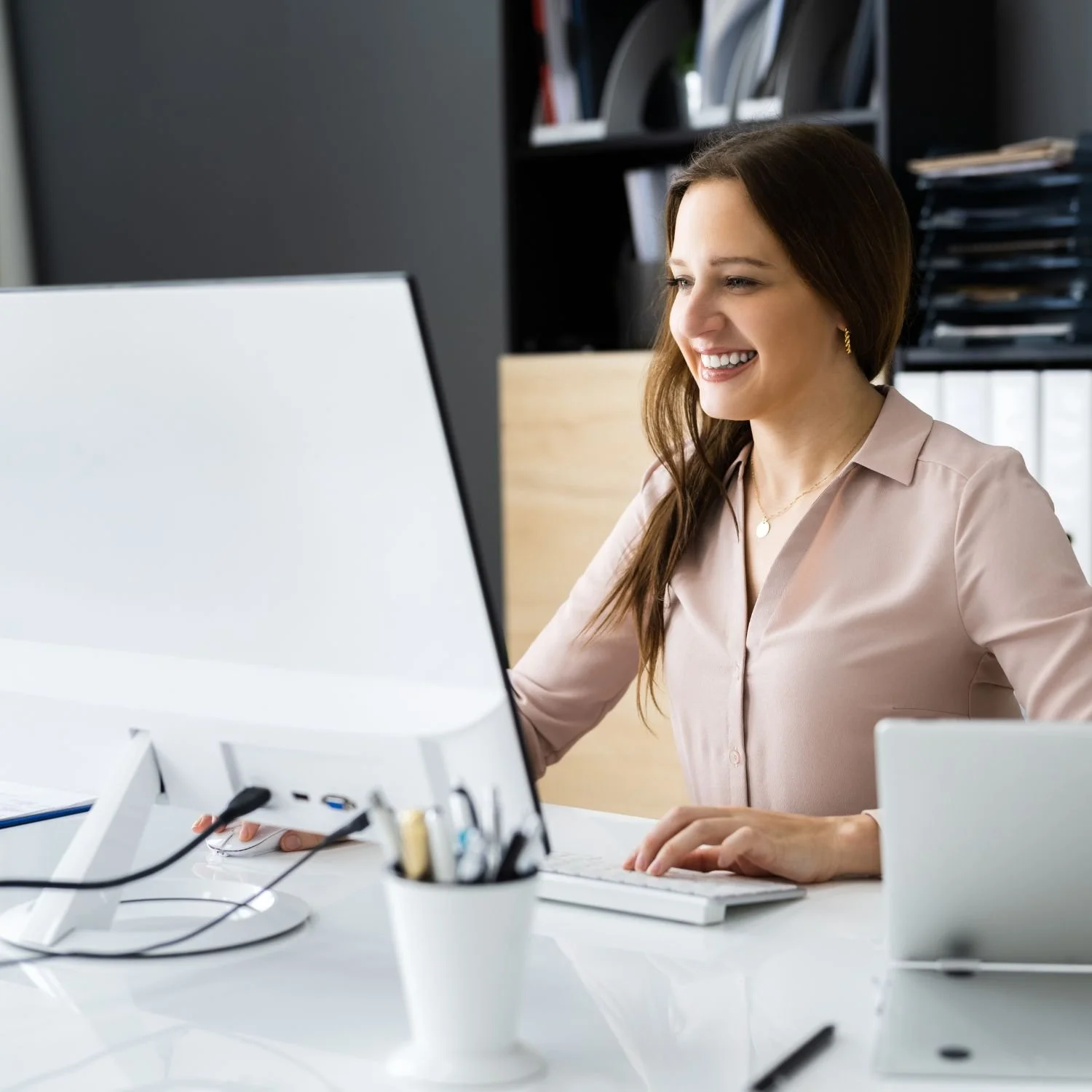 Executive Assistant at computer