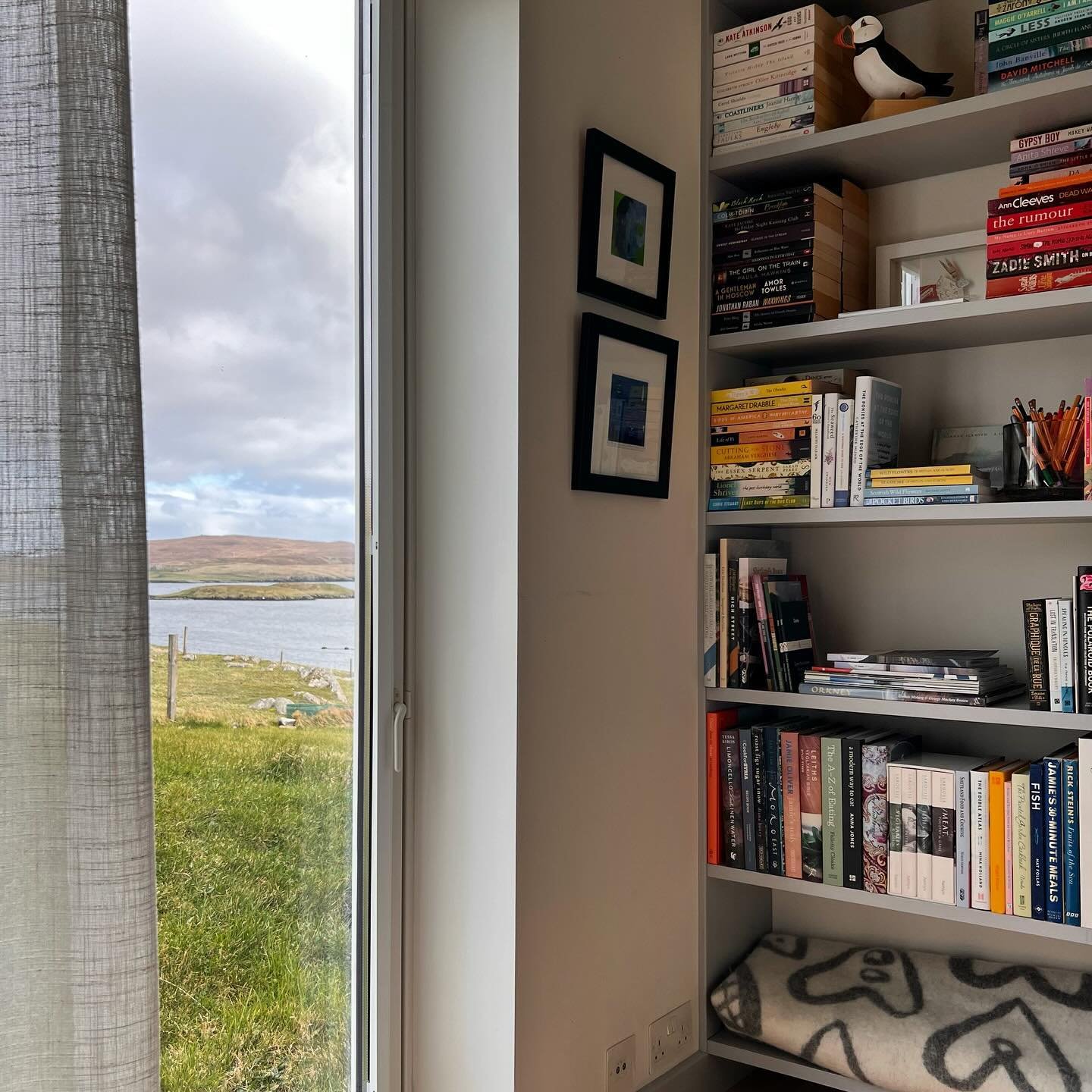 The view from the bed, if you tire from it we have lots of books to read.  Lots of novels and books of local interest #shetland #stayshetland