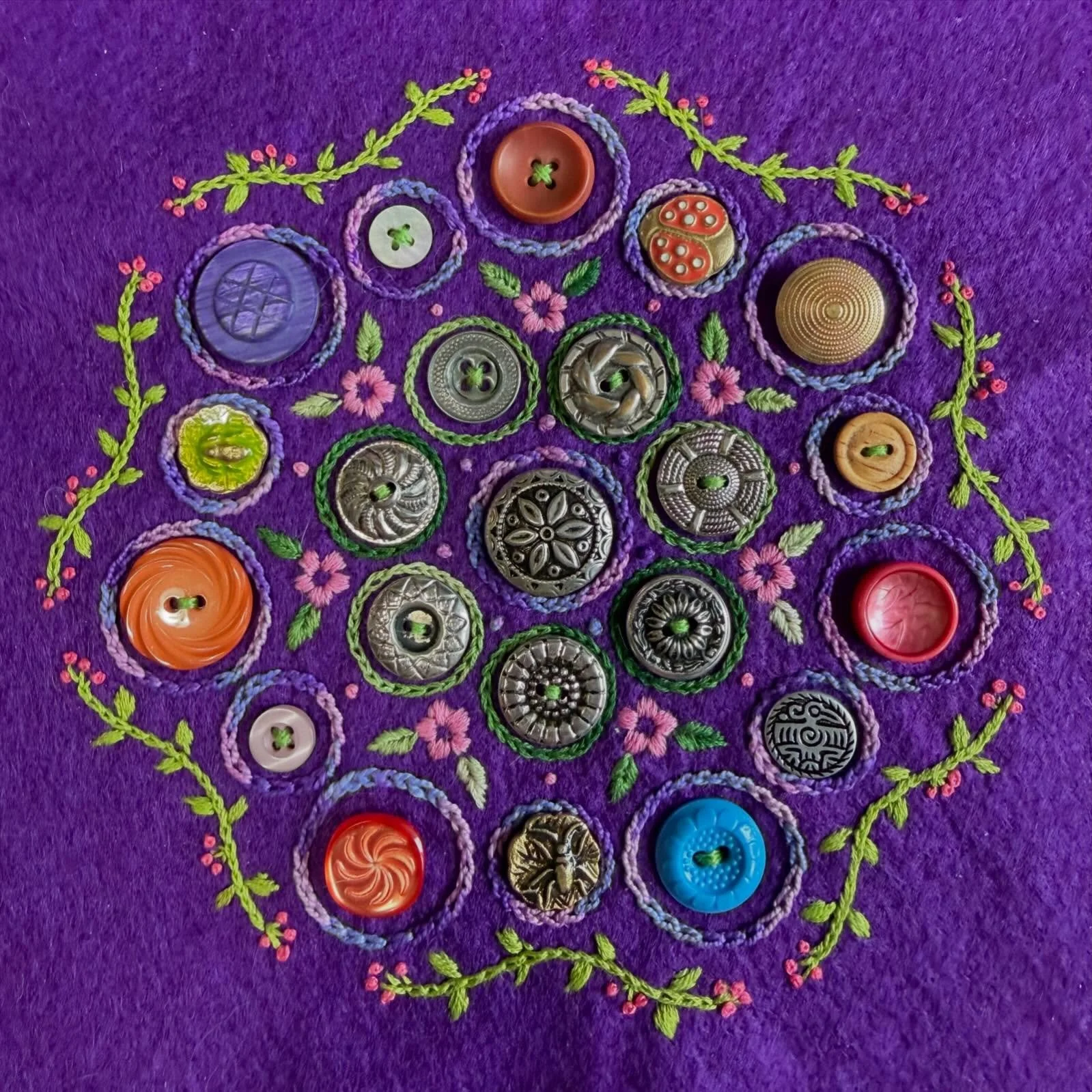 I made another button display embroidery! This one is an original design, so it will be a pattern soon. Would you be interested in stitching your own?