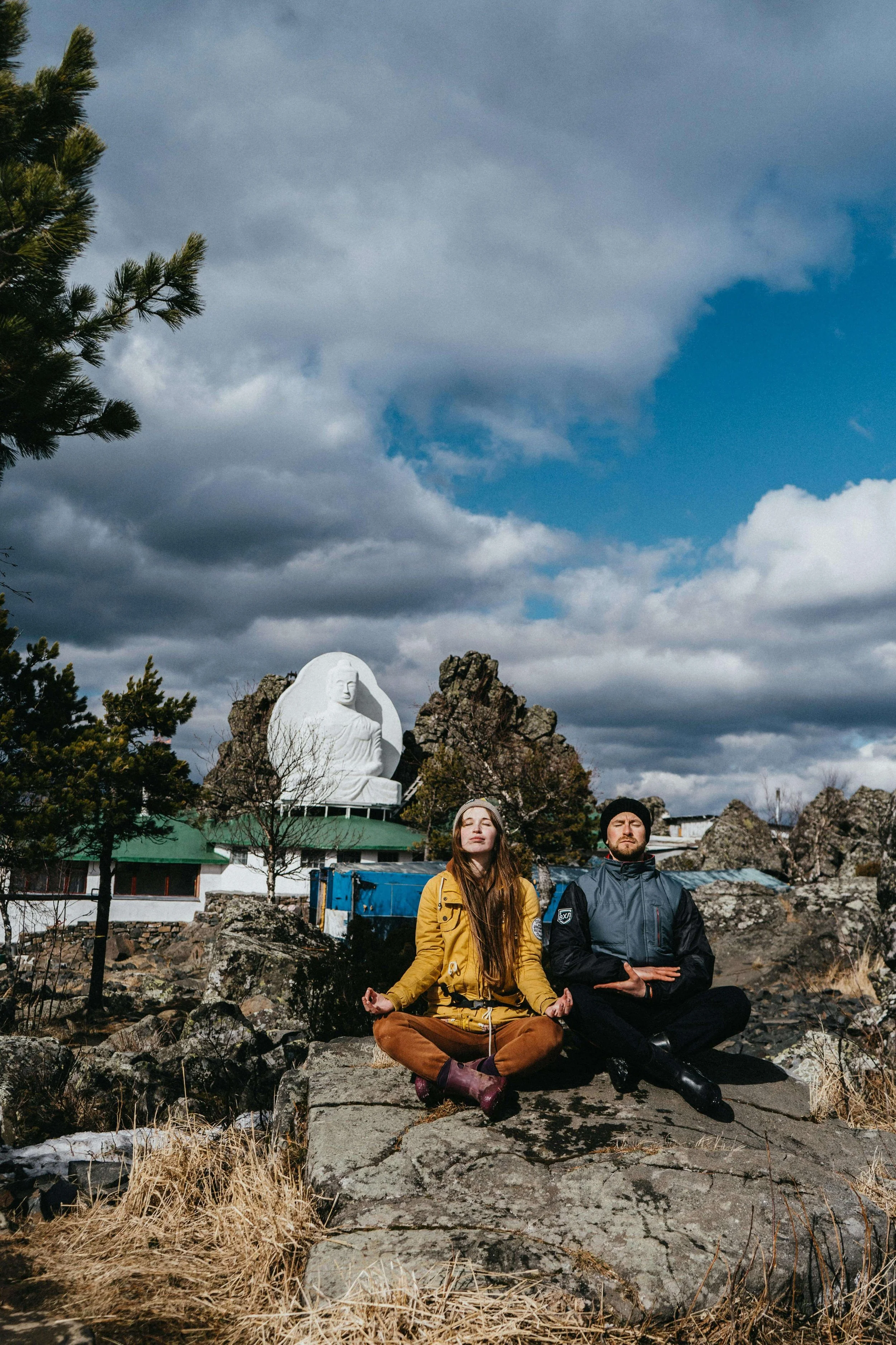 Two people meditating together outdoors, representing the mindful connection explored in somatic couples therapy in St. Paul, MN, with a couples therapist in Saint Paul, MN.