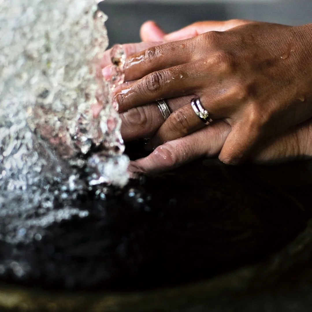 Two hands with wedding rings with water splashing. This represents how Marcus Hunt Therapy provides counseling for couples in Utah.