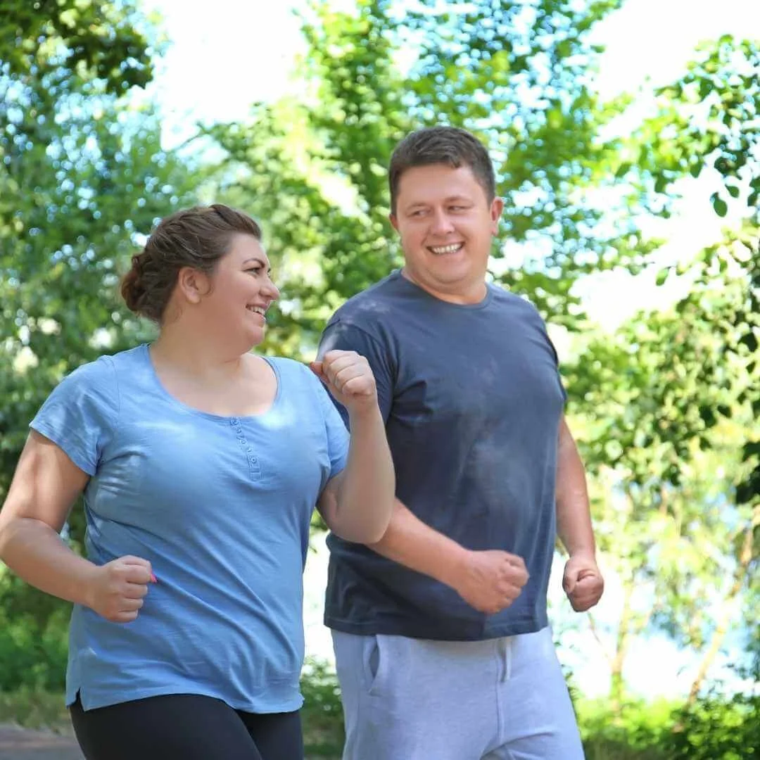 A couple running together and smiling. This represents how Marcus Hunt Therapy provides couples counseling in Utah, EMDR therapy, and anxiety therapy in Utah.