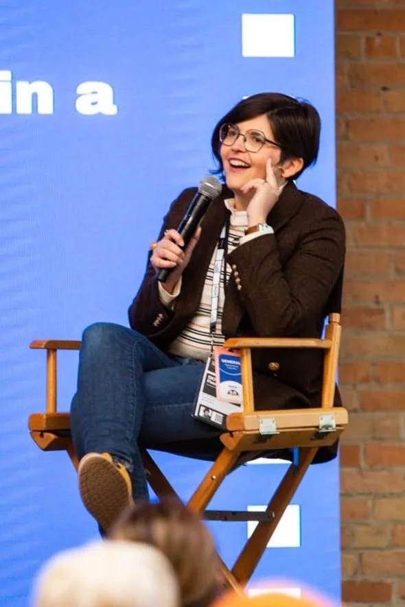 Julie Ann speaking at an event