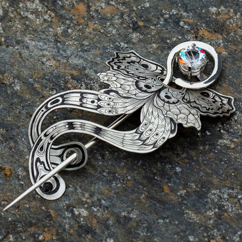 Her is another view of the butterfly brooch.  I ended up doing the forming on the butterfly after the engraving was done *and* the enamel was applied. It was a bit scary to do some bending such a late stage in the fabrication process, but thankfully 