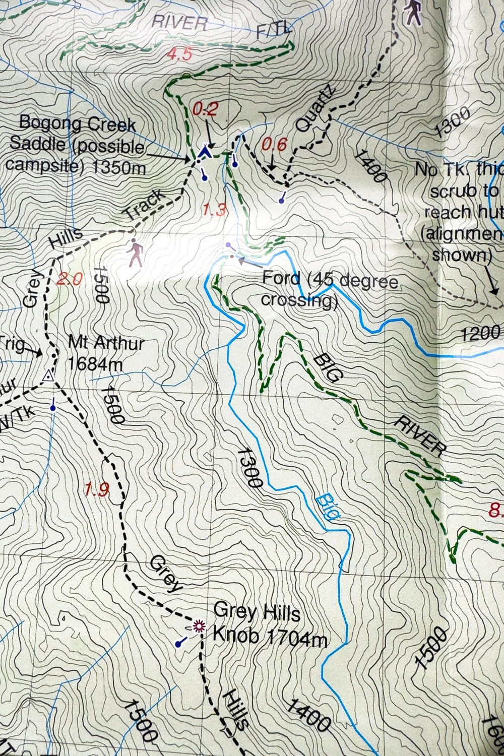 Rooftop paper map with detailed contours and track features marked on in