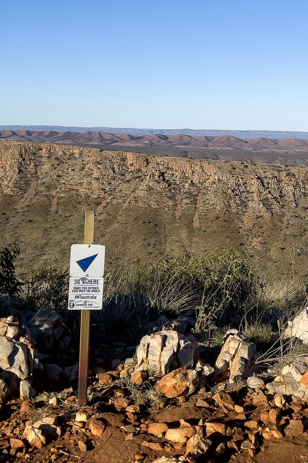 small white sign indicating that there is phone coverage at that point