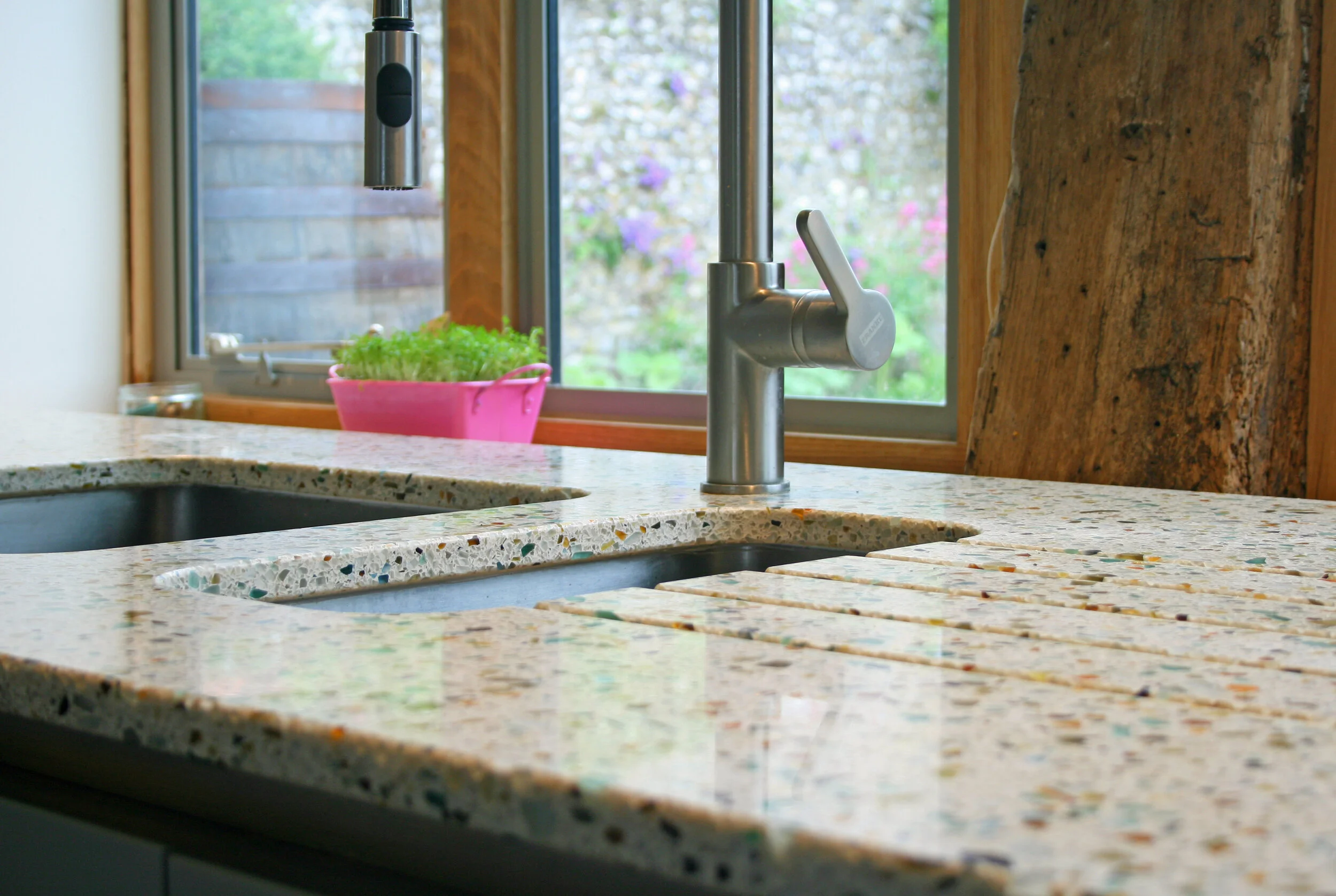 Colourful and sustainable worktops in a converted barn in East Sussex for architect client, Including stainless steel under mounted sink and drainange grooves
