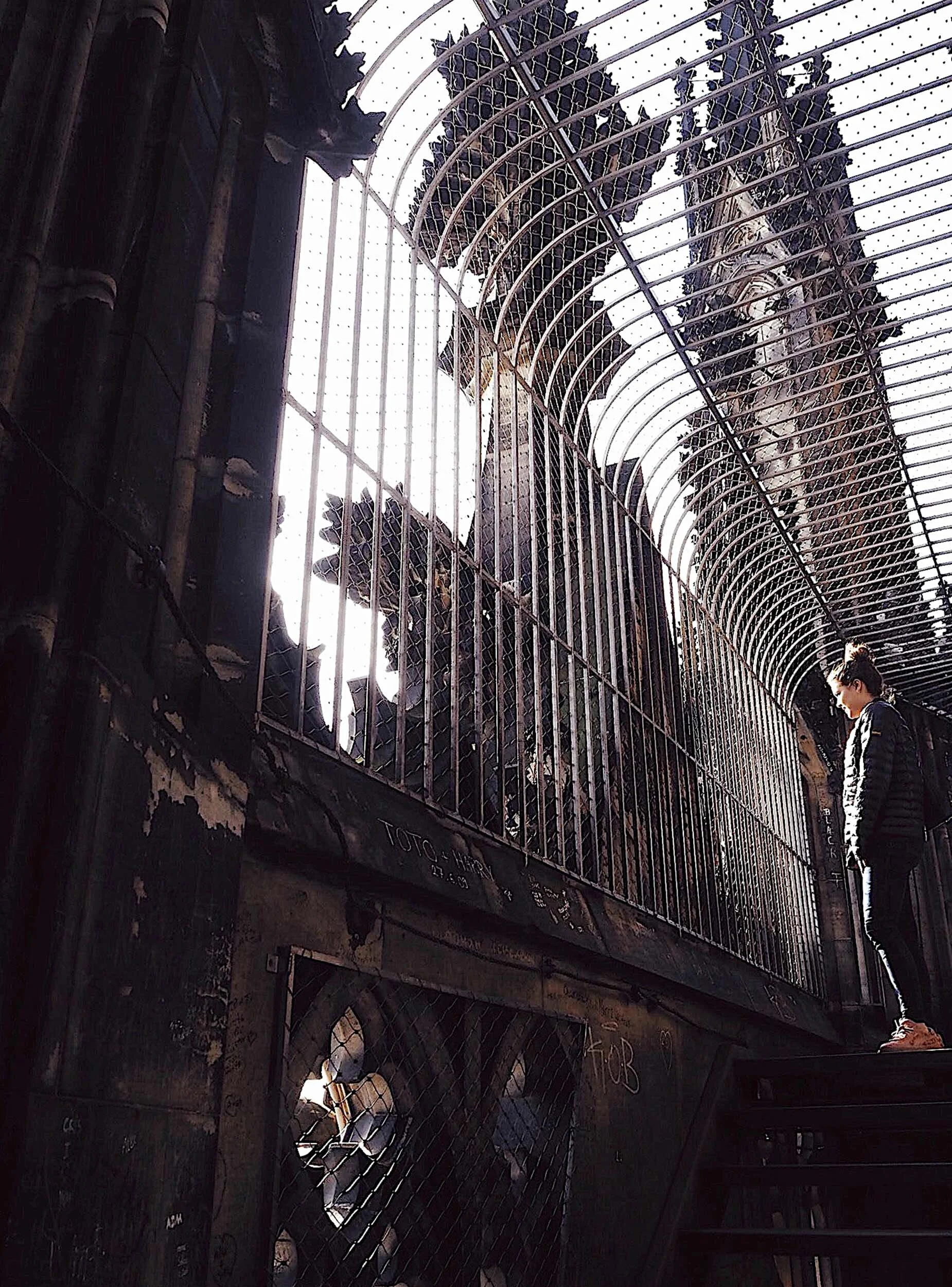 young-woman-standing-looking-out-from-top-koln-cathedral.jpg