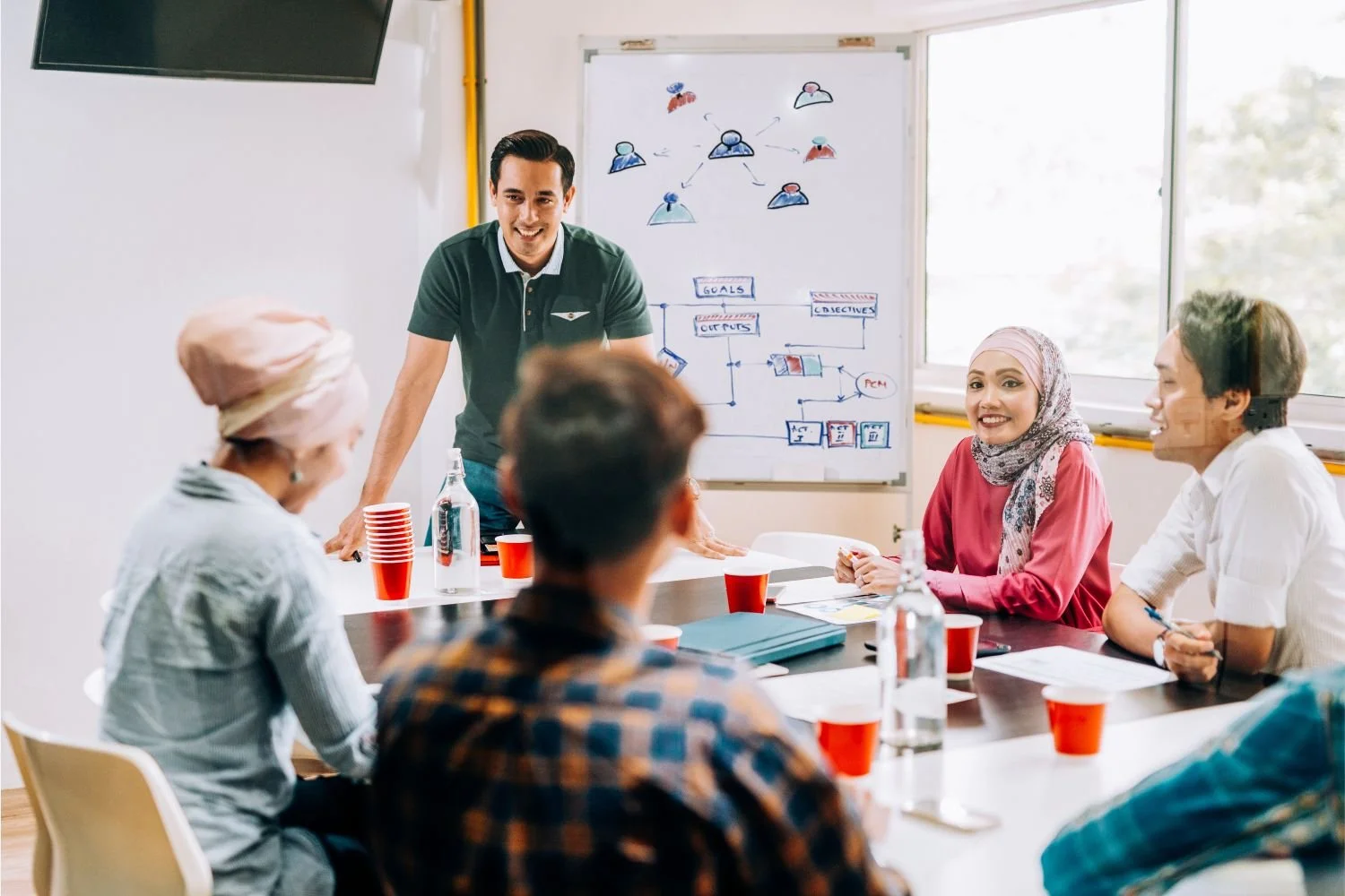 A diverse group of leaders engaged in a workshop