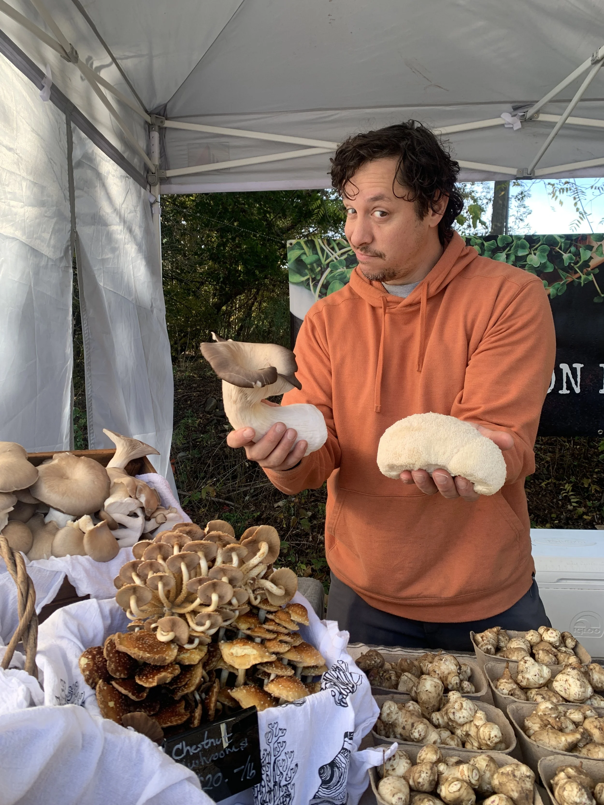 Joe the Mushroom Man showing off his fresh local produce at the Tunkhannock Farmers Market in Tunkhannock PA.