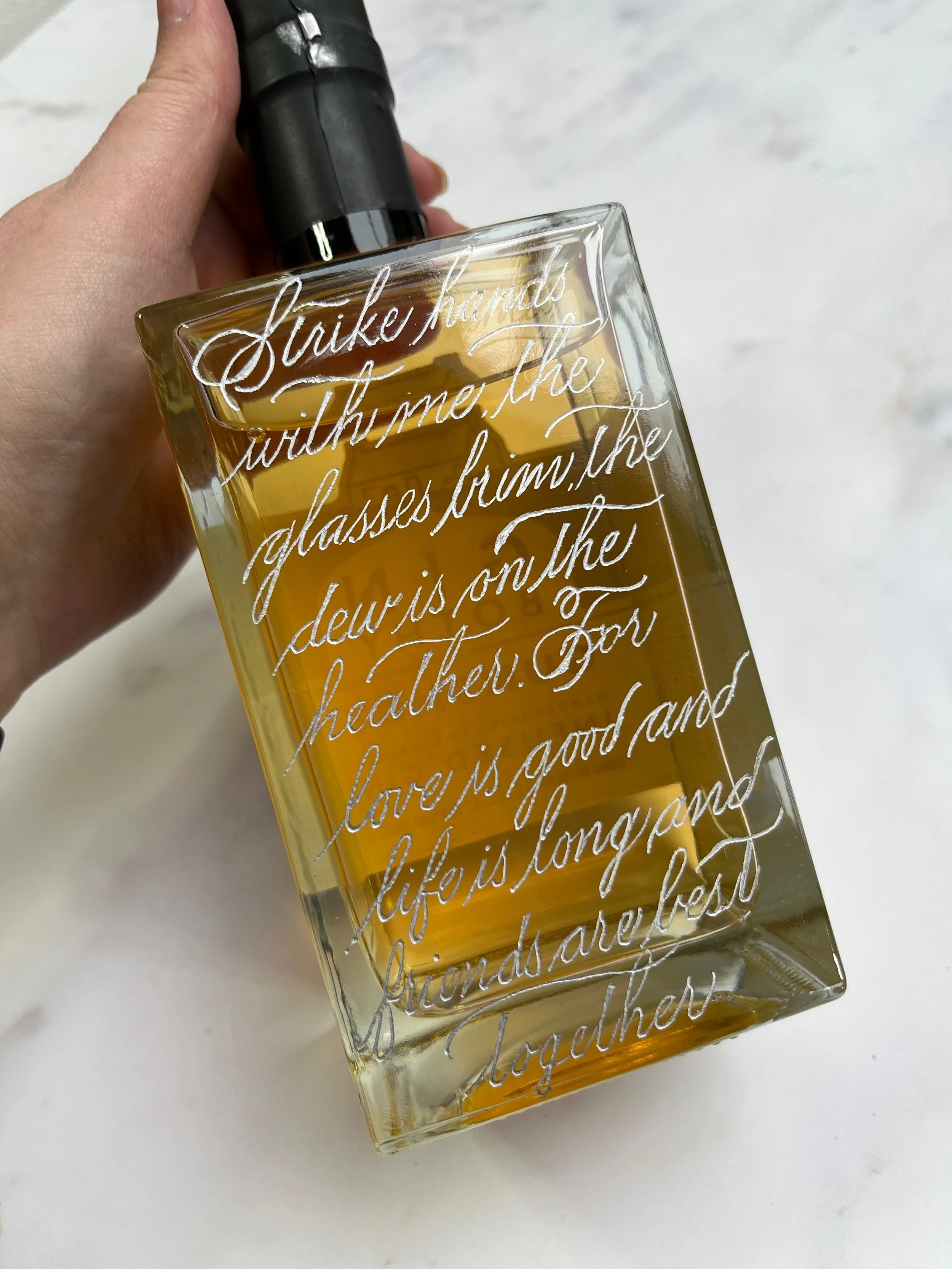 Engraved gin bottle in spencerian