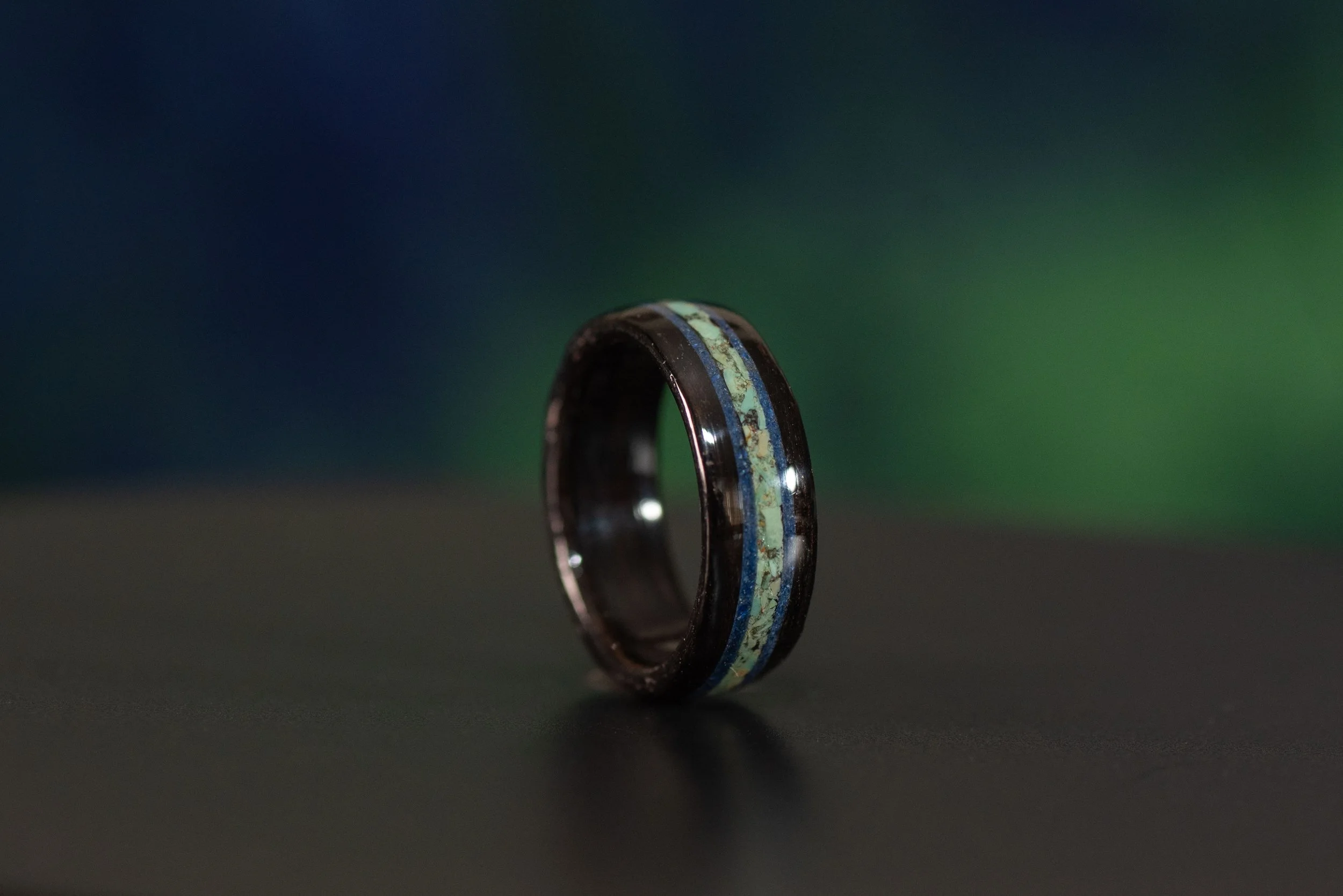 Custom wood ring with blue gemstone inlay, handmade design