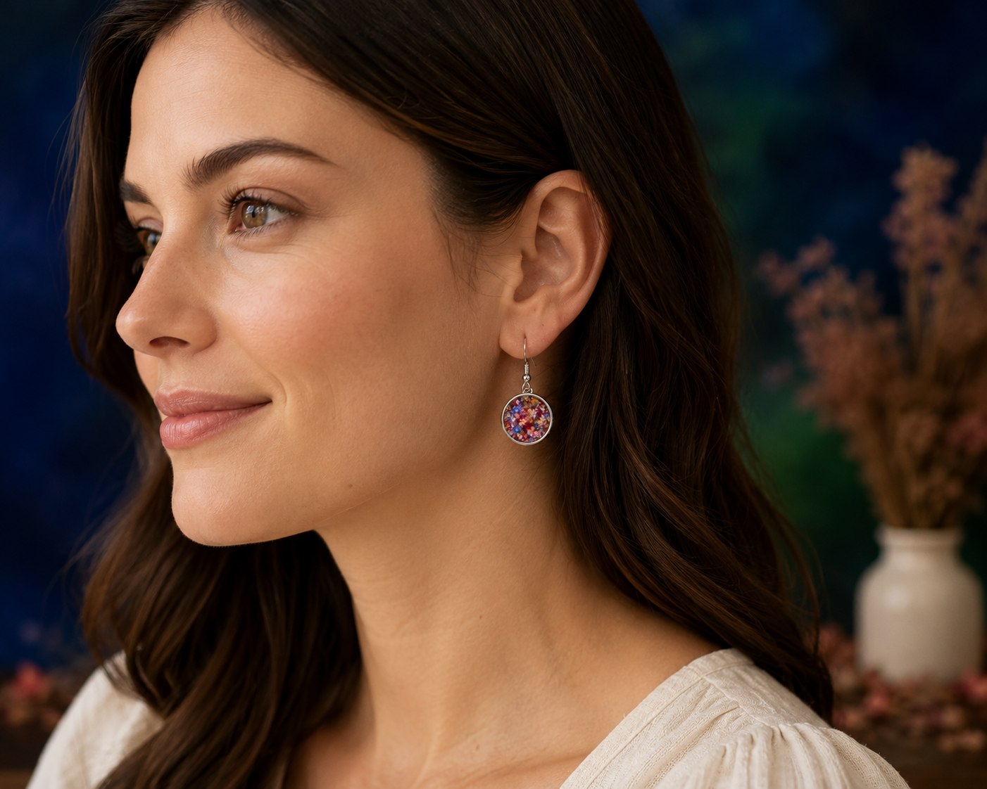 Woman wearing sterling silver flower preservation earrings made from preserved wedding bouquet flowers