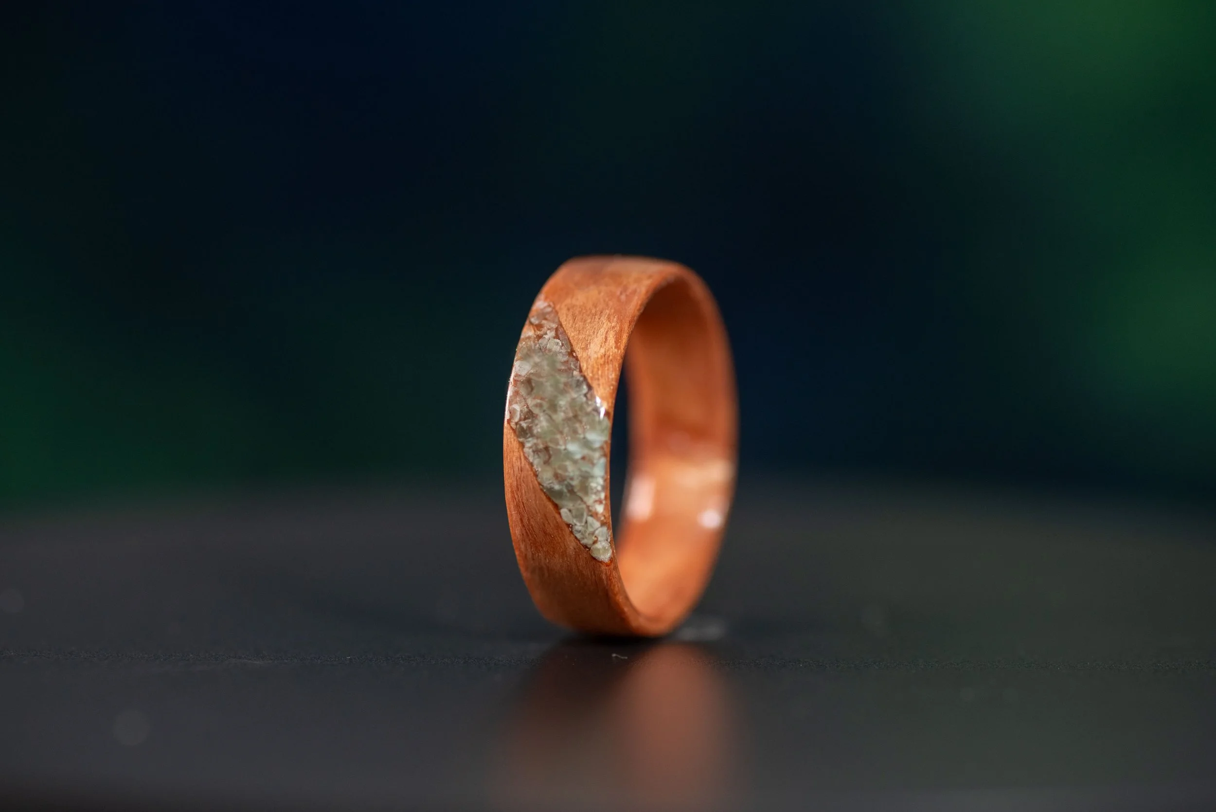 Nature inspired wood ring featuring jade stone accent