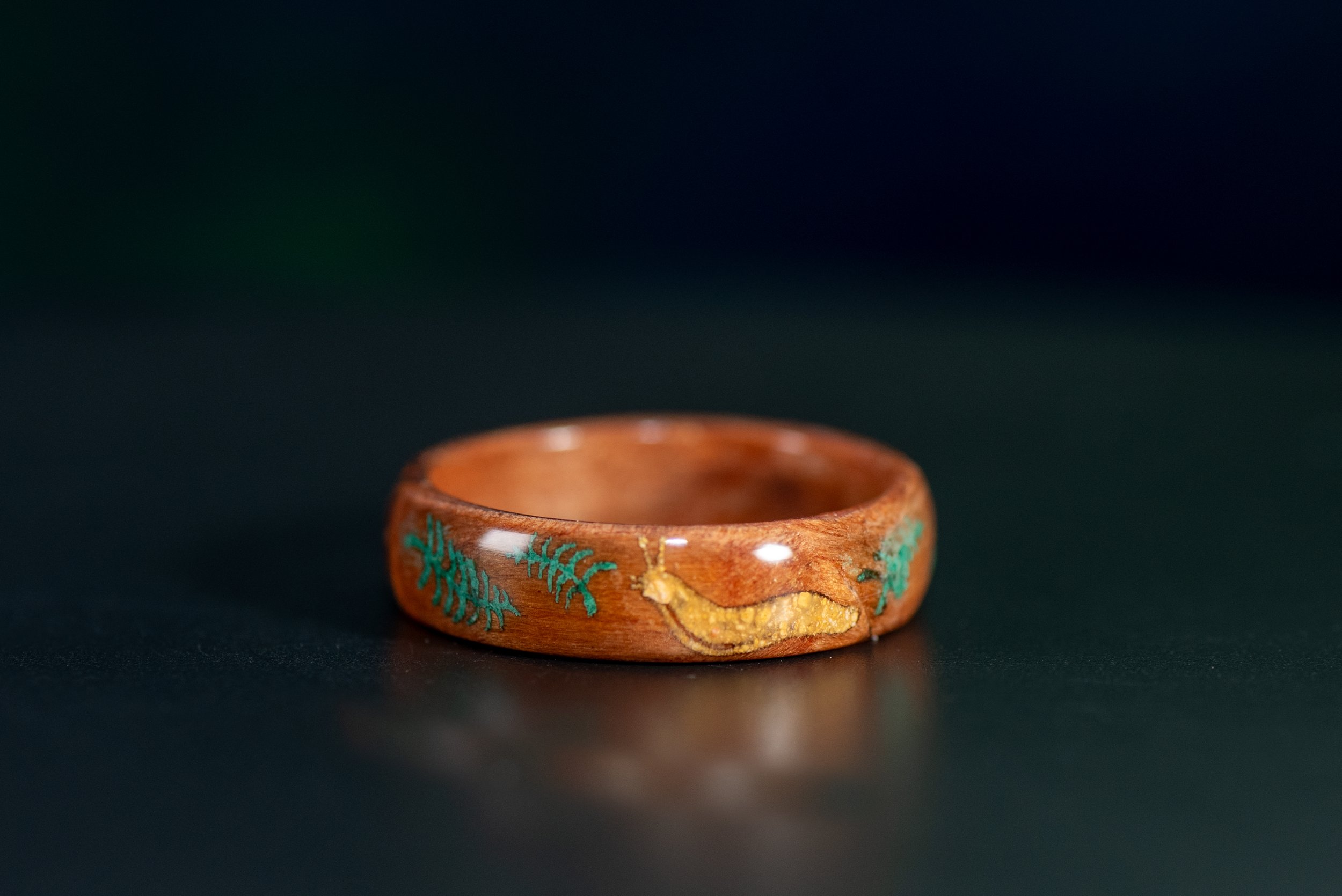 Nature inspired Santa Cruz ring with California redwood wood, yellow jasper banana slug and malachite fern design.