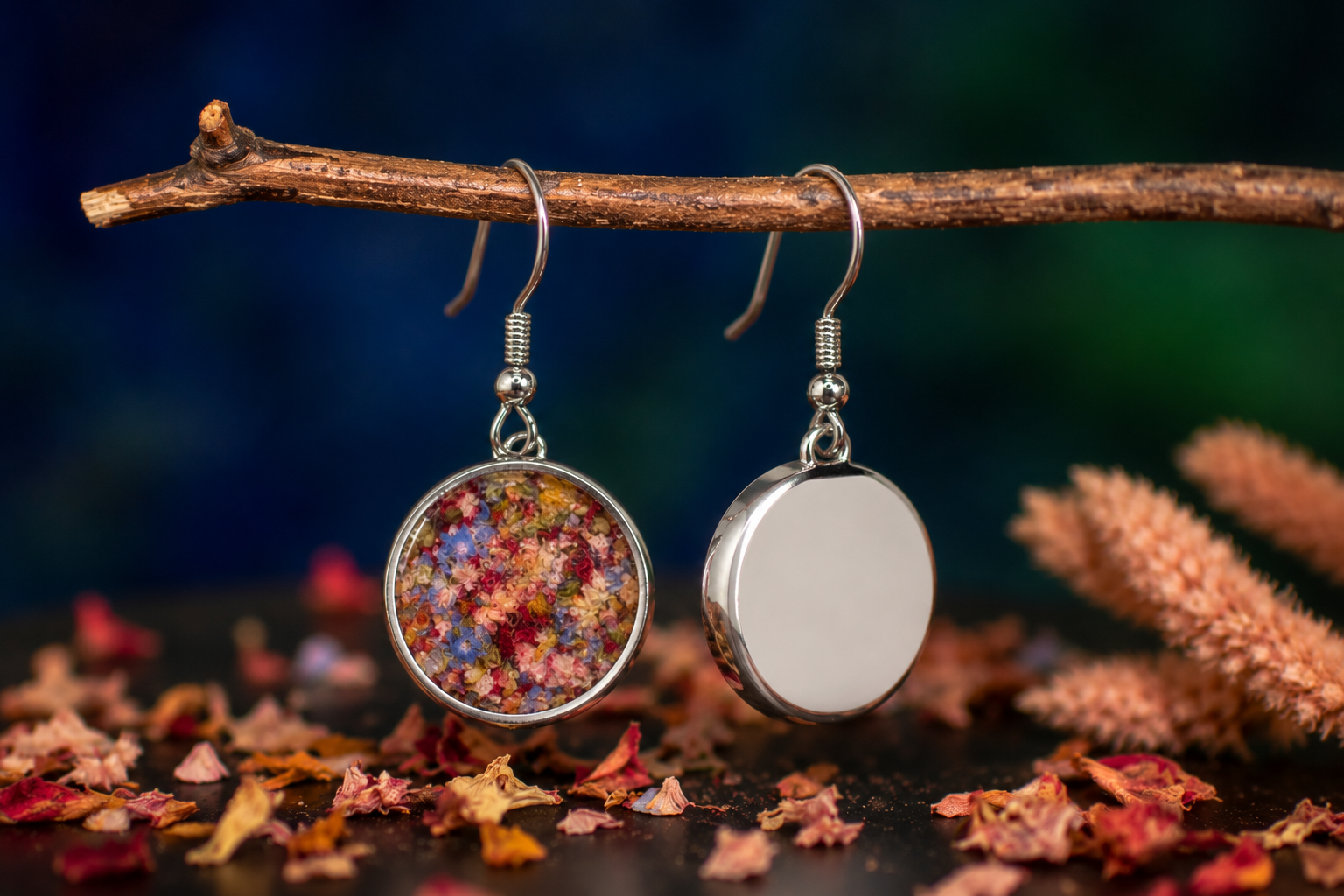 Close-up of custom sterling silver keepsake earrings featuring preserved flowers from a wedding bouquet