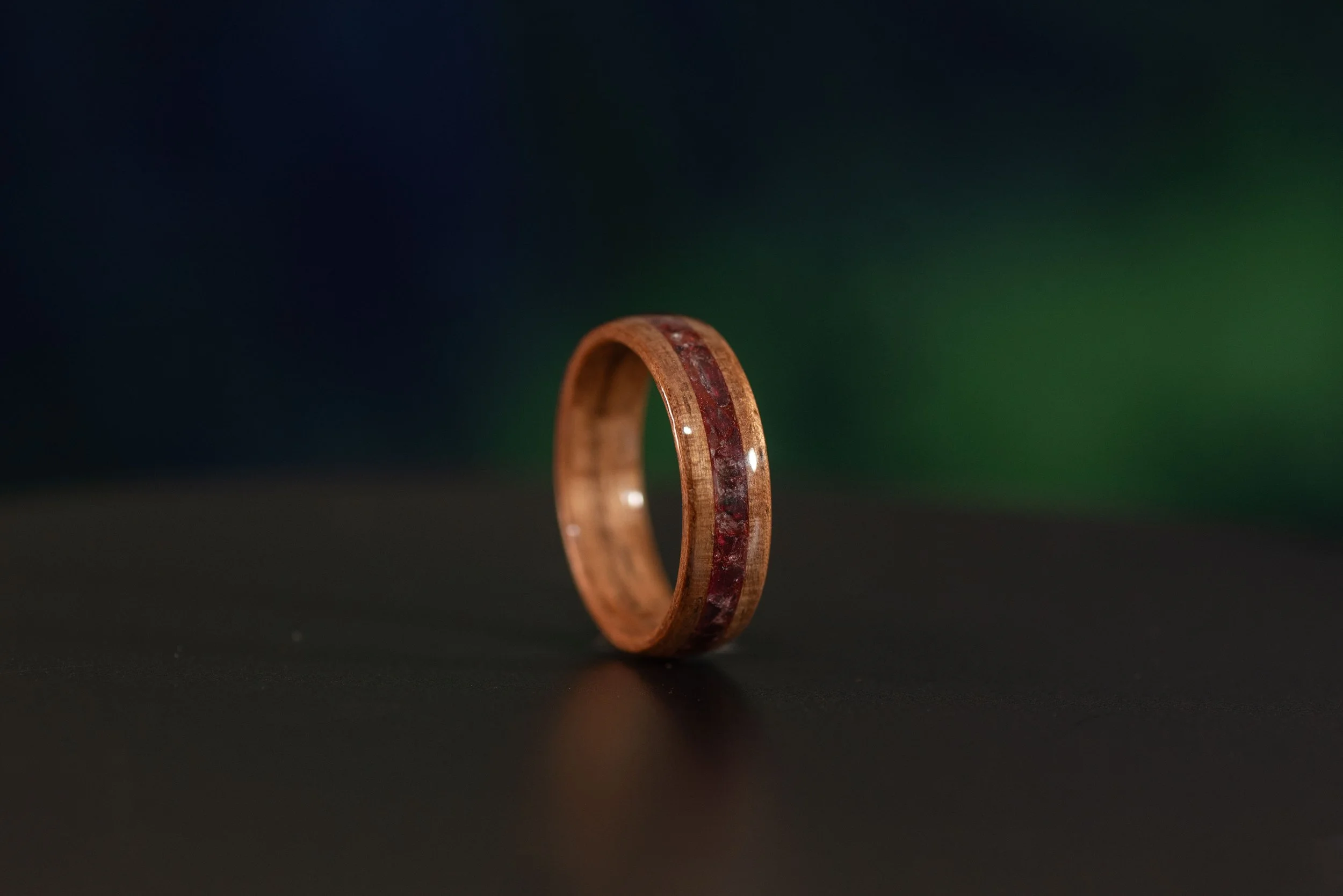 Natural black walnut ring featuring January birthstone garnet