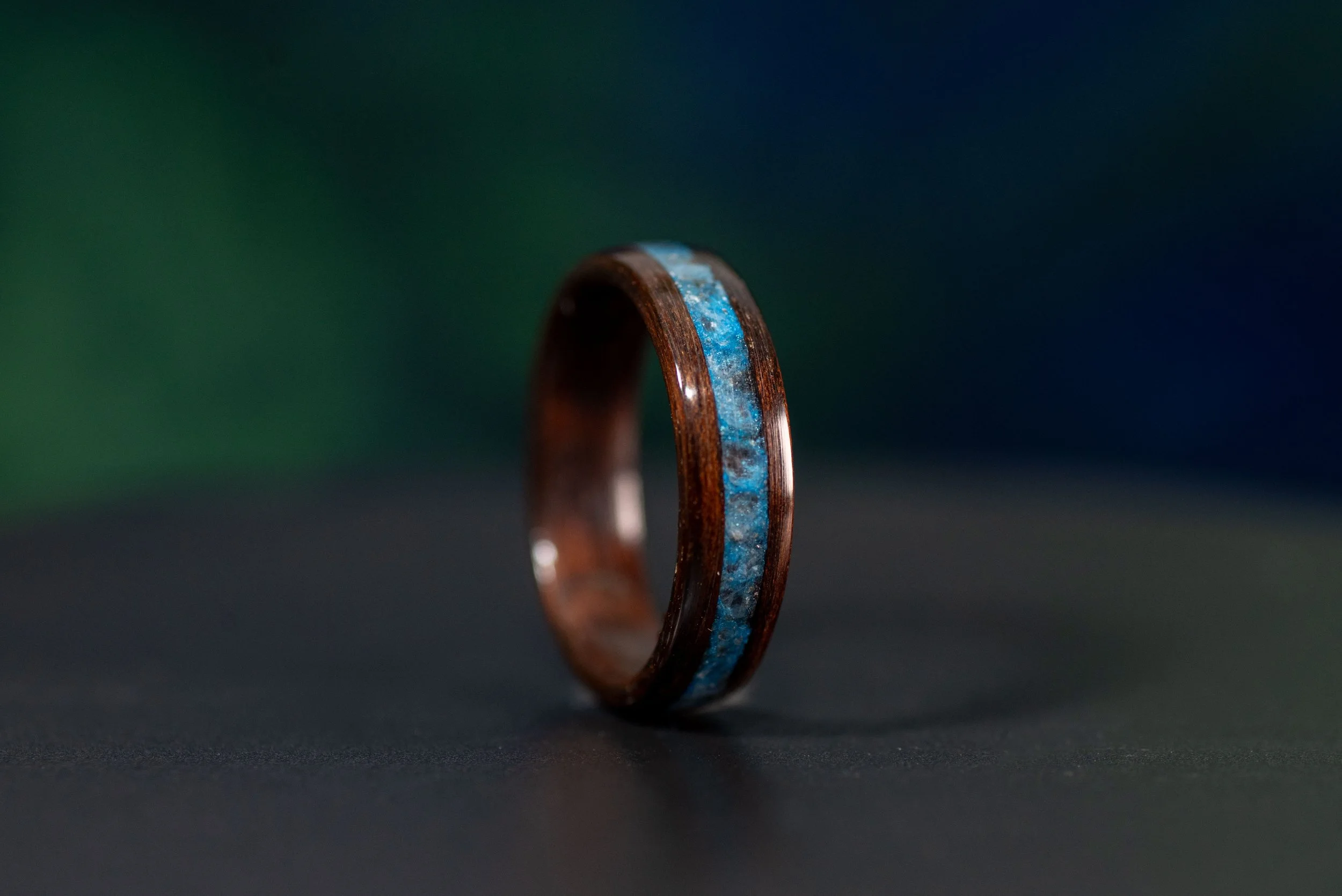 Nature inspired wood wedding band with blue aquamarine inlay