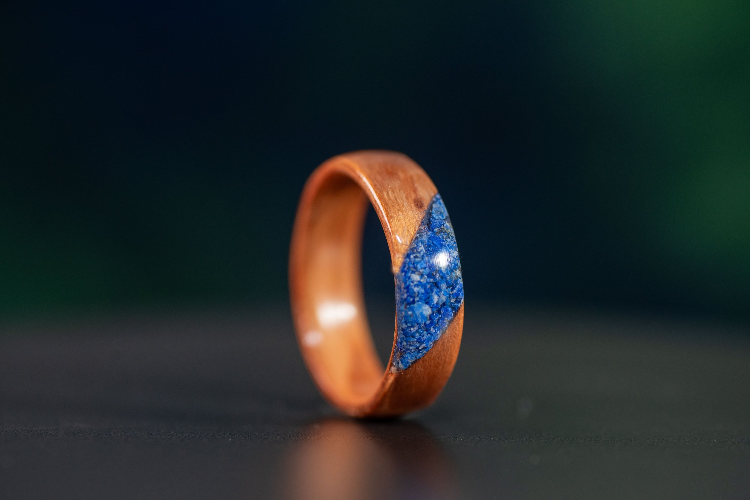 Custom redwood ring with diamond-shaped lapis lazuli accent