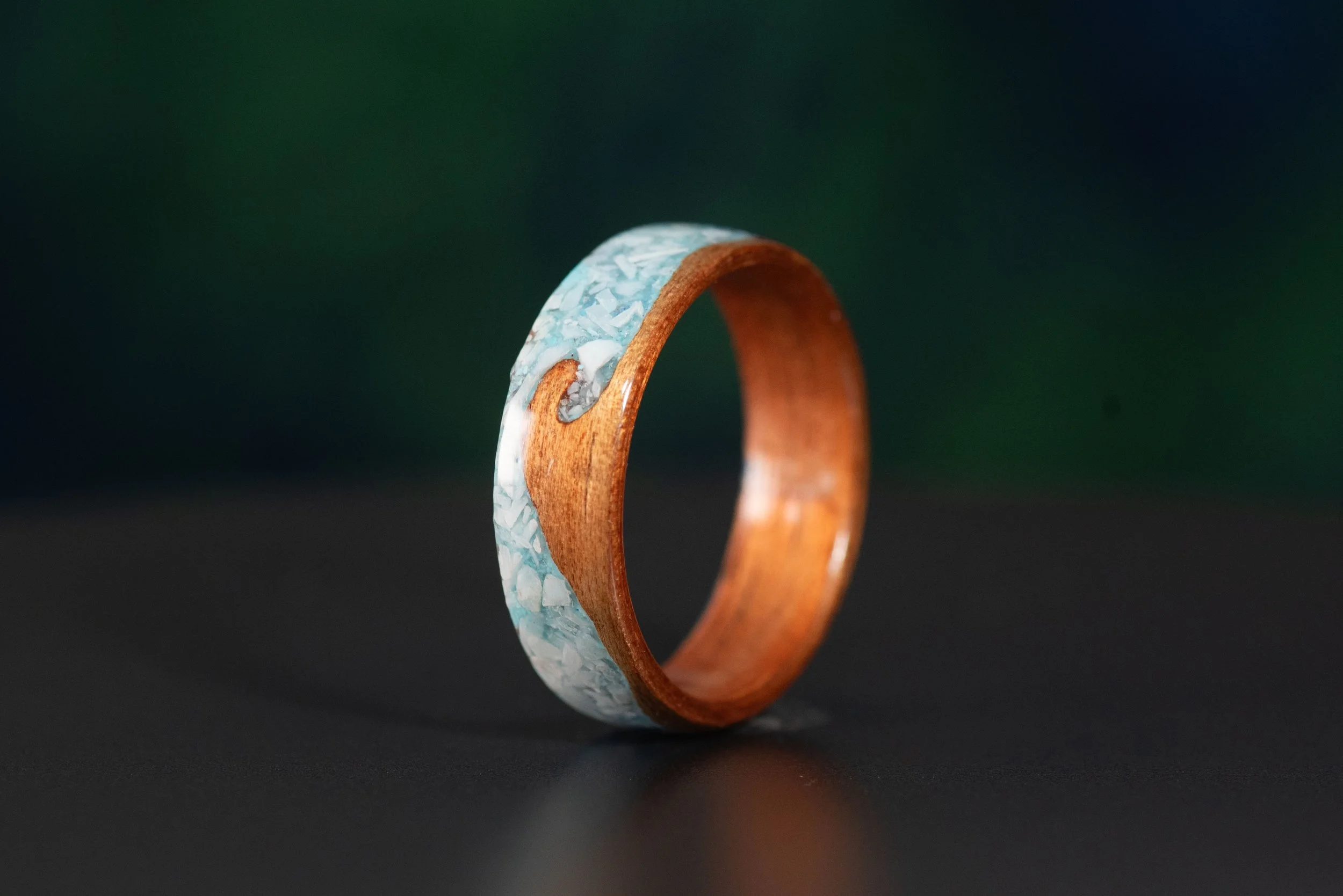 Ocean inspired men’s wood ring featuring natural koa, turquoise and blue larimar inlay.