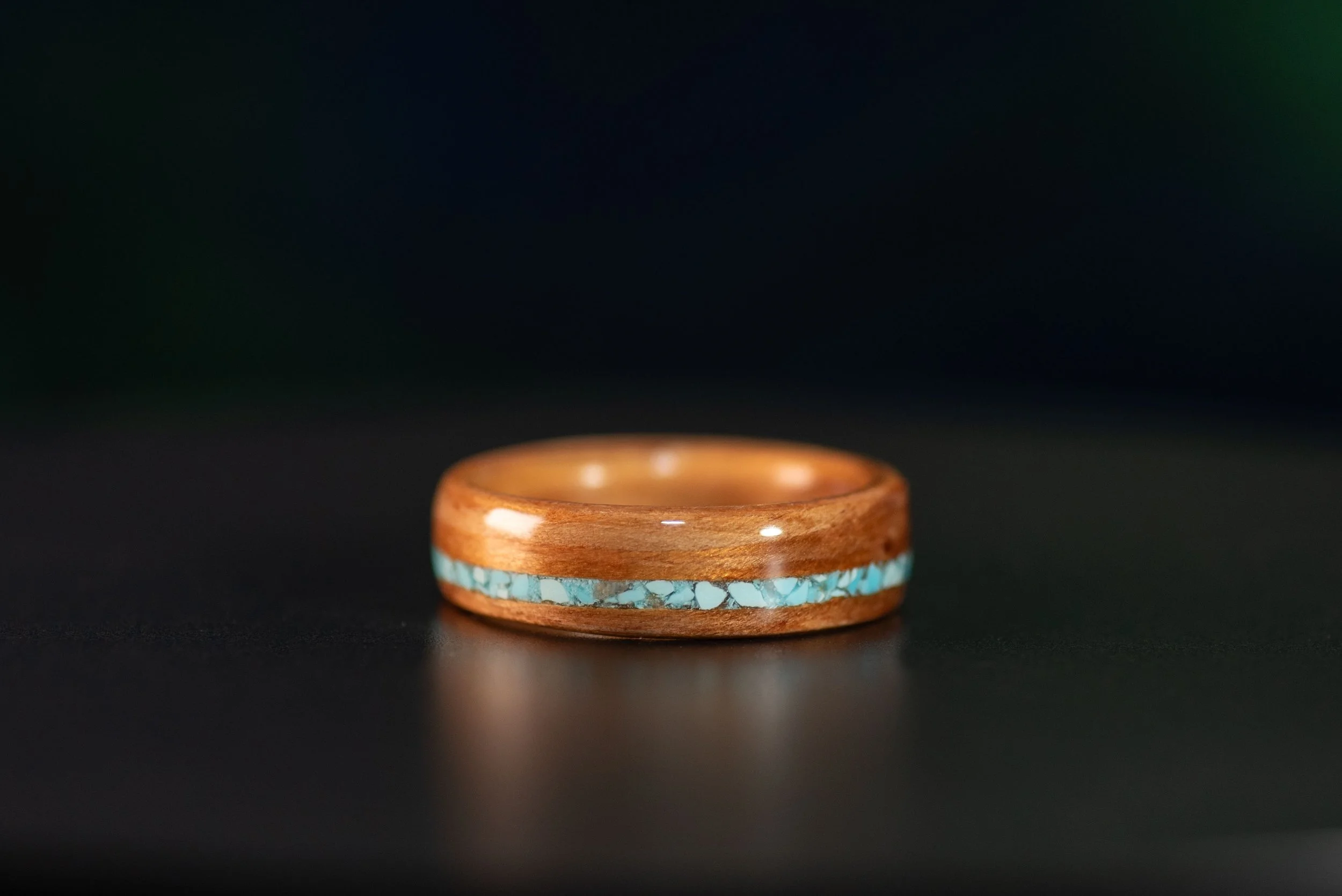 Unique wood wedding band with turquoise stripe inlay