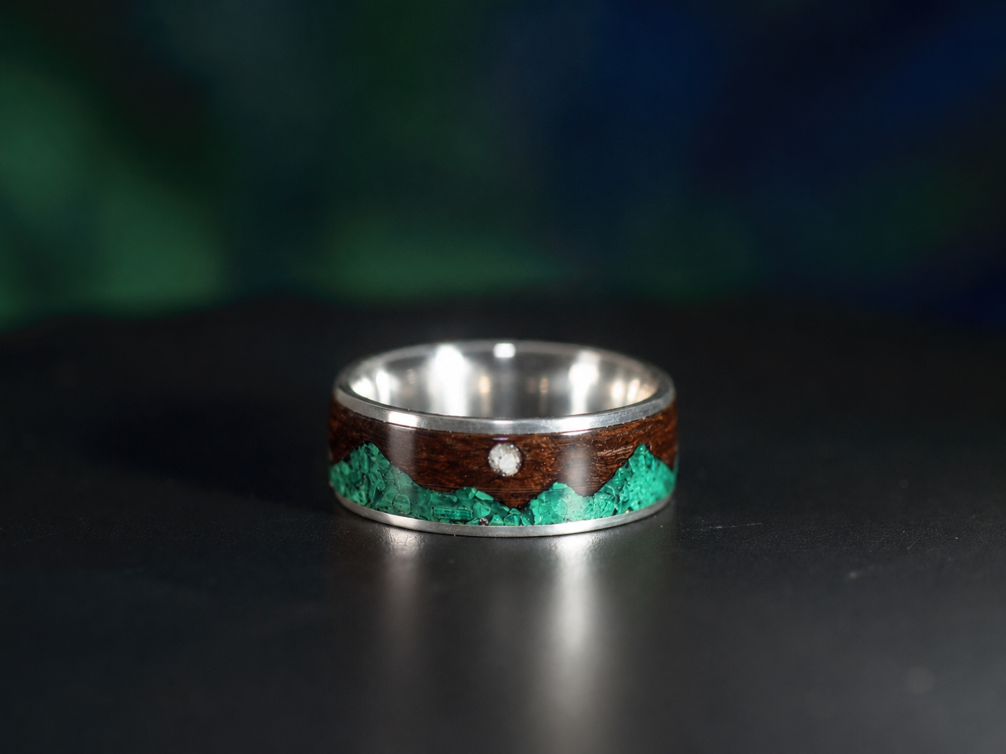 Sterling silver ring with smoked rosewood, green malachite mountain inlay, and a moonstone moon, available in 6mm and 8mm widths.