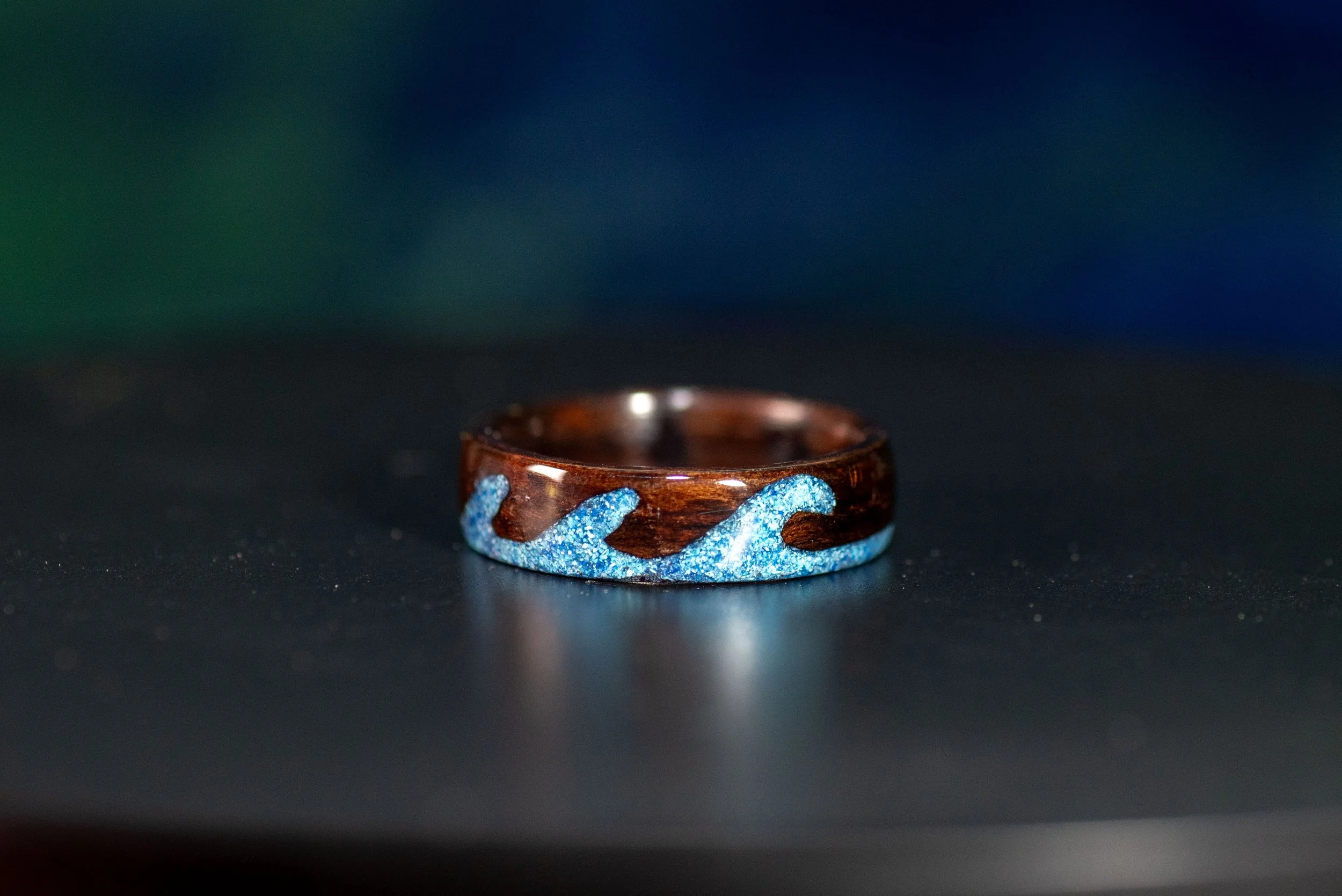 Nature inspired wood ring featuring ocean-inspired triple wave design