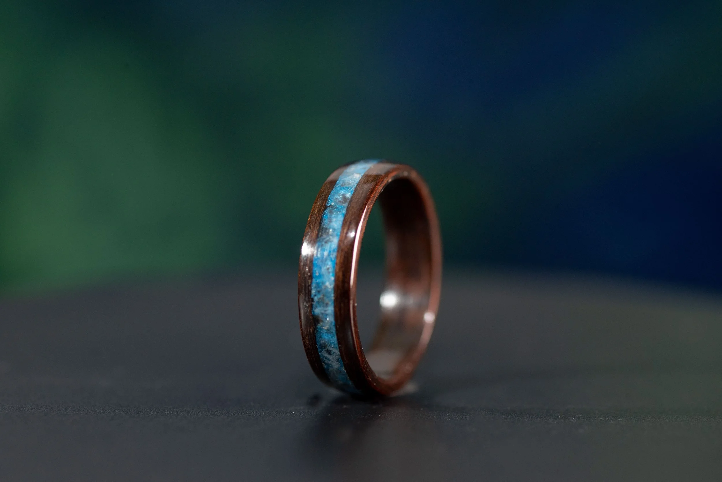 Dark wood ring featuring March birthstone aquamarine