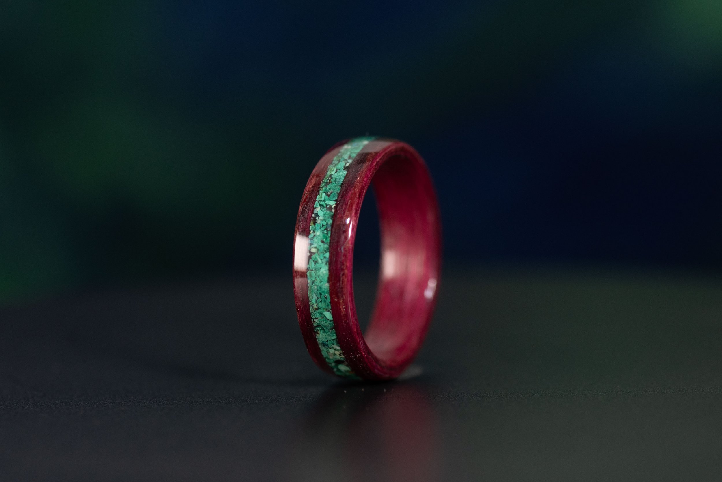 Unique purpleheart wood ring with colorful gemstone inlay
