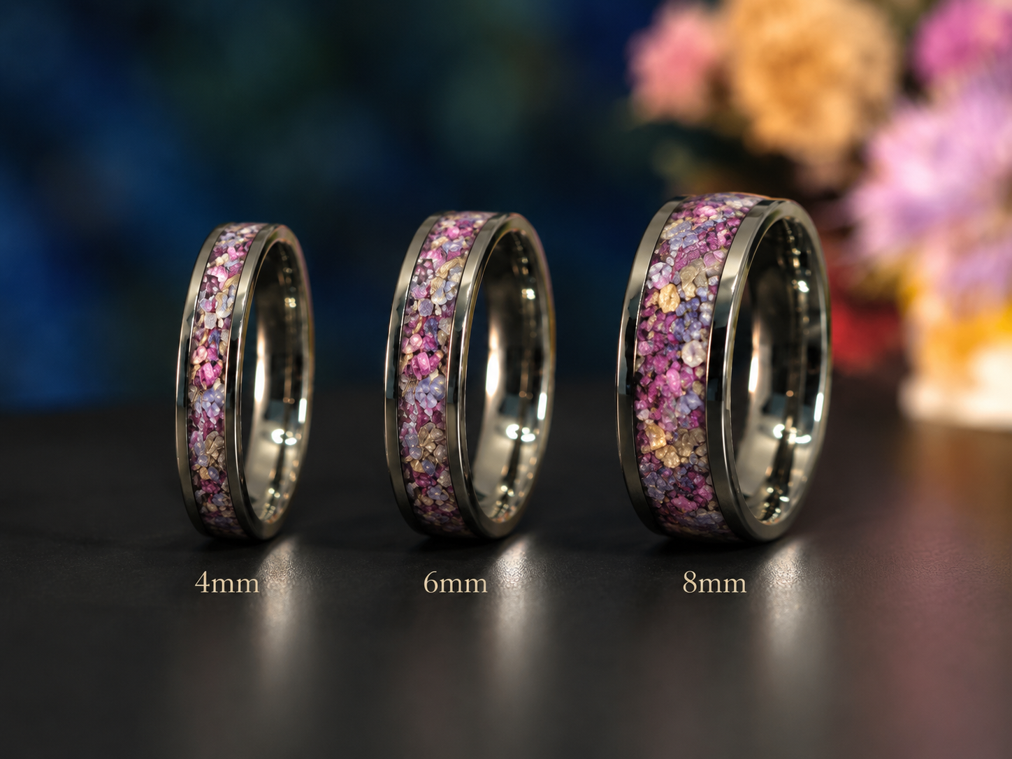 Handmade titanium memorial ring containing preserved flowers from a funeral or celebration of life arrangement.