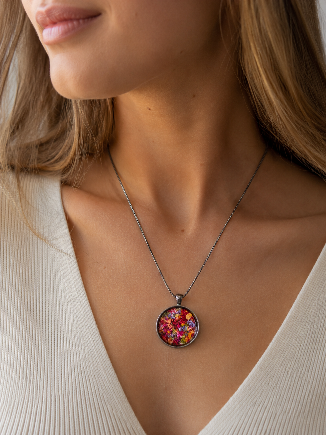 Memorial flower pendant handcrafted from flowers sent by customers