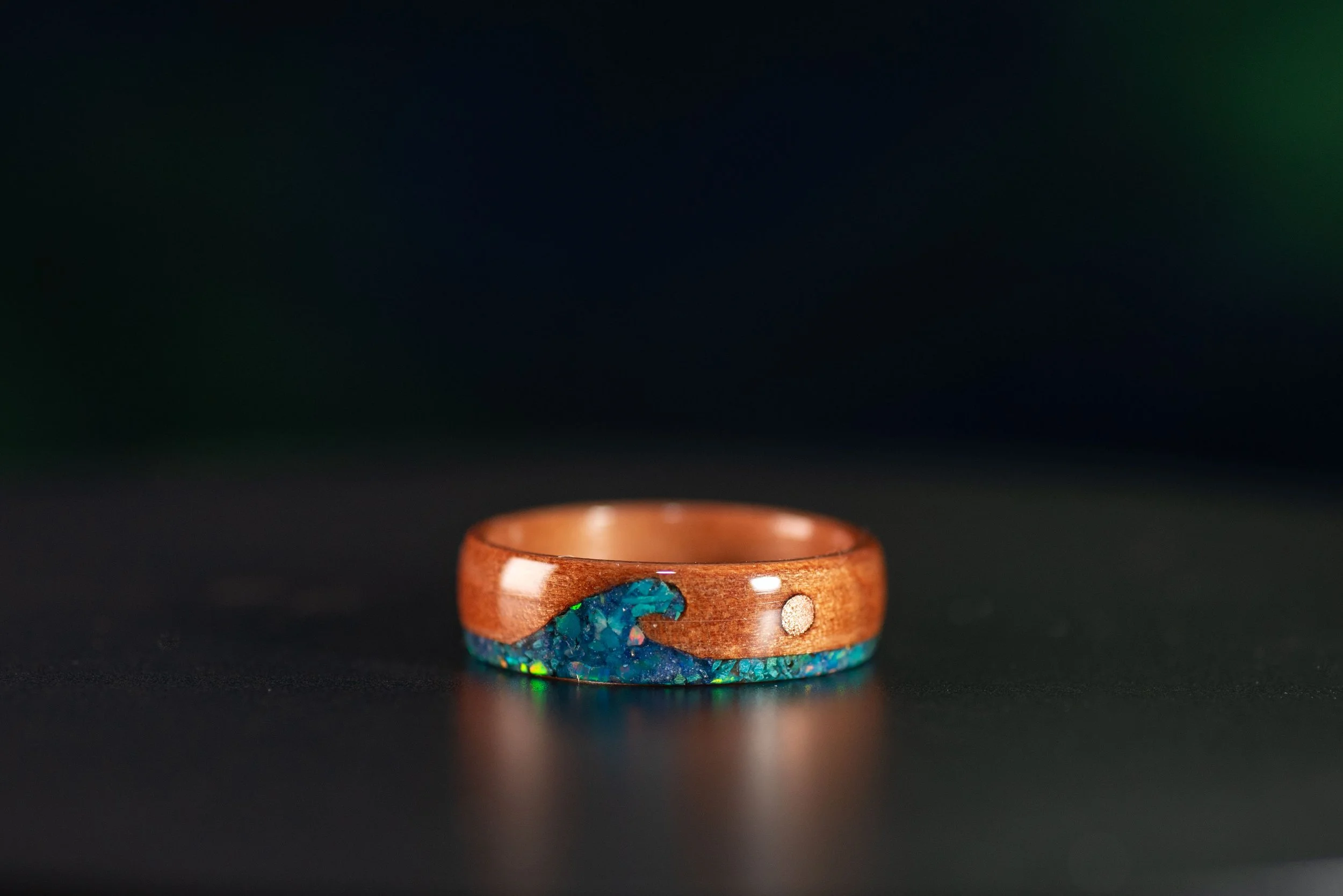 Unique wood wedding band for men or women with ocean-inspired inlay